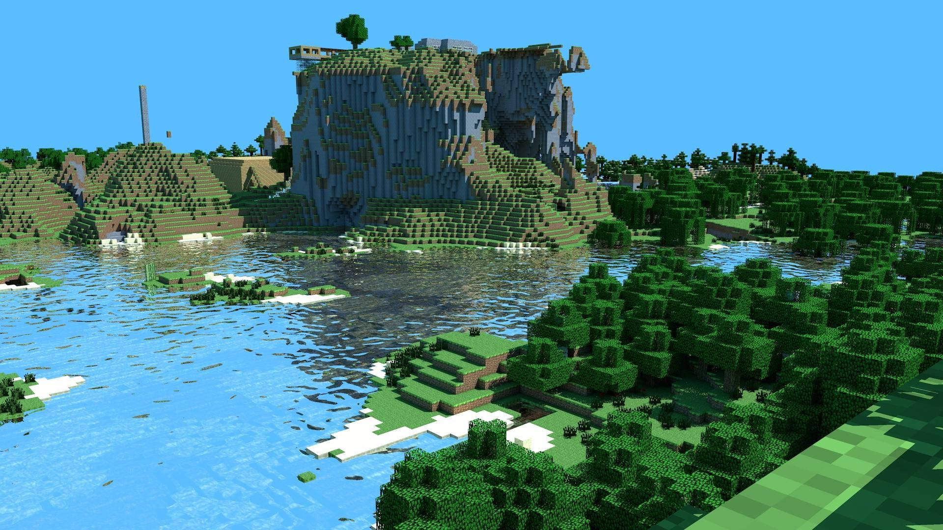 Minecraft Aesthetic 桌布 壁紙 — 一個方塊狀的Minecraft景觀，有高聳的懸崖、茂密的綠色森林，以及晴朗天空下平靜的藍色河流。