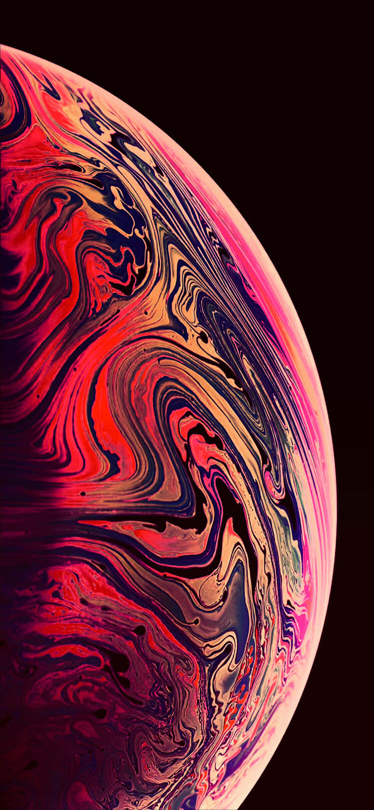 Apple iPhone Xs Max 桌布 壁紙 — 一個旋轉的宇宙球體，帶有鮮豔的紅色、粉紅色和紫色，背景是黑色虛空。