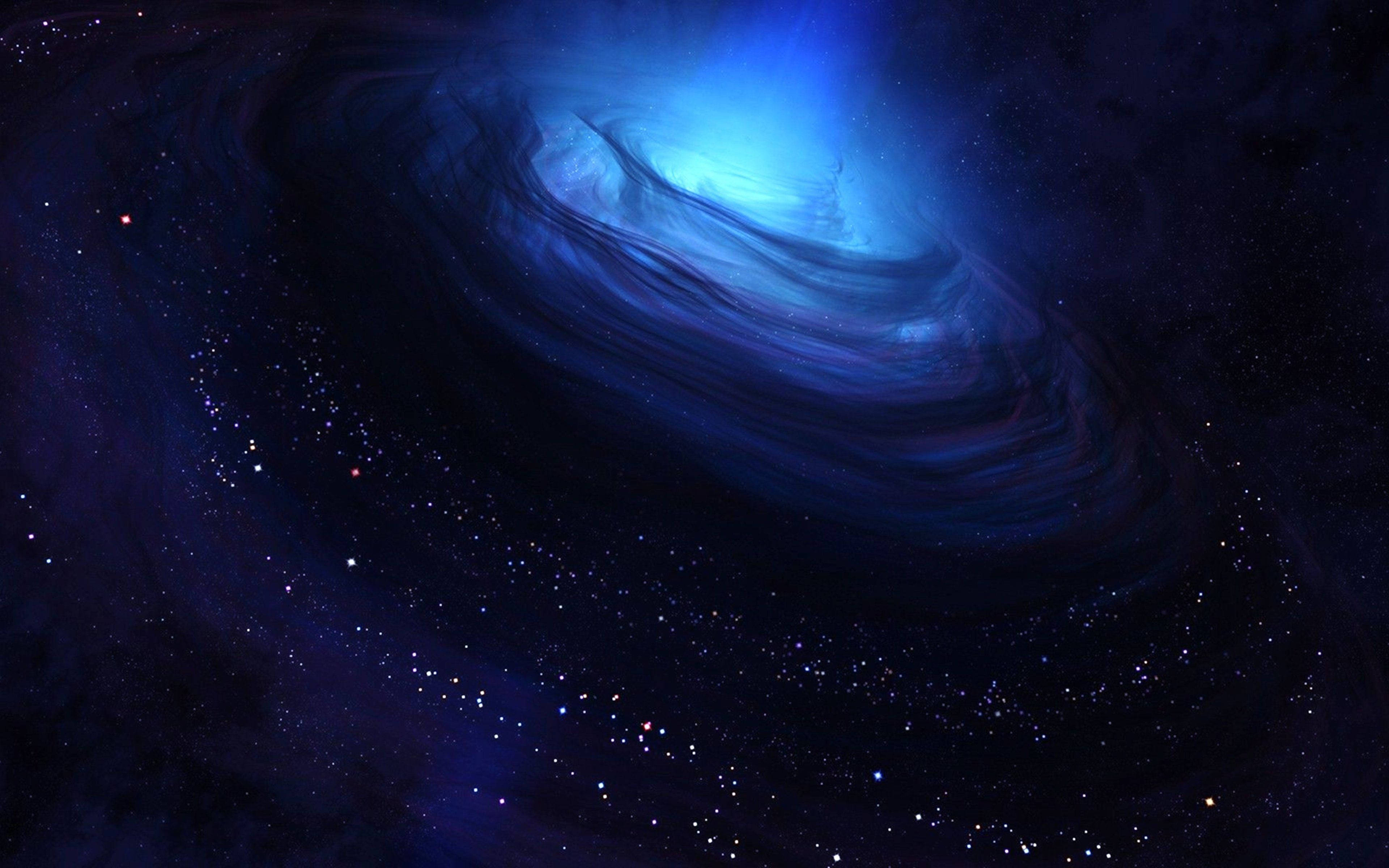 星雲 桌布 壁紙 — 一個旋轉的藍色螺旋星系在深空的星場中發出宇宙光芒。