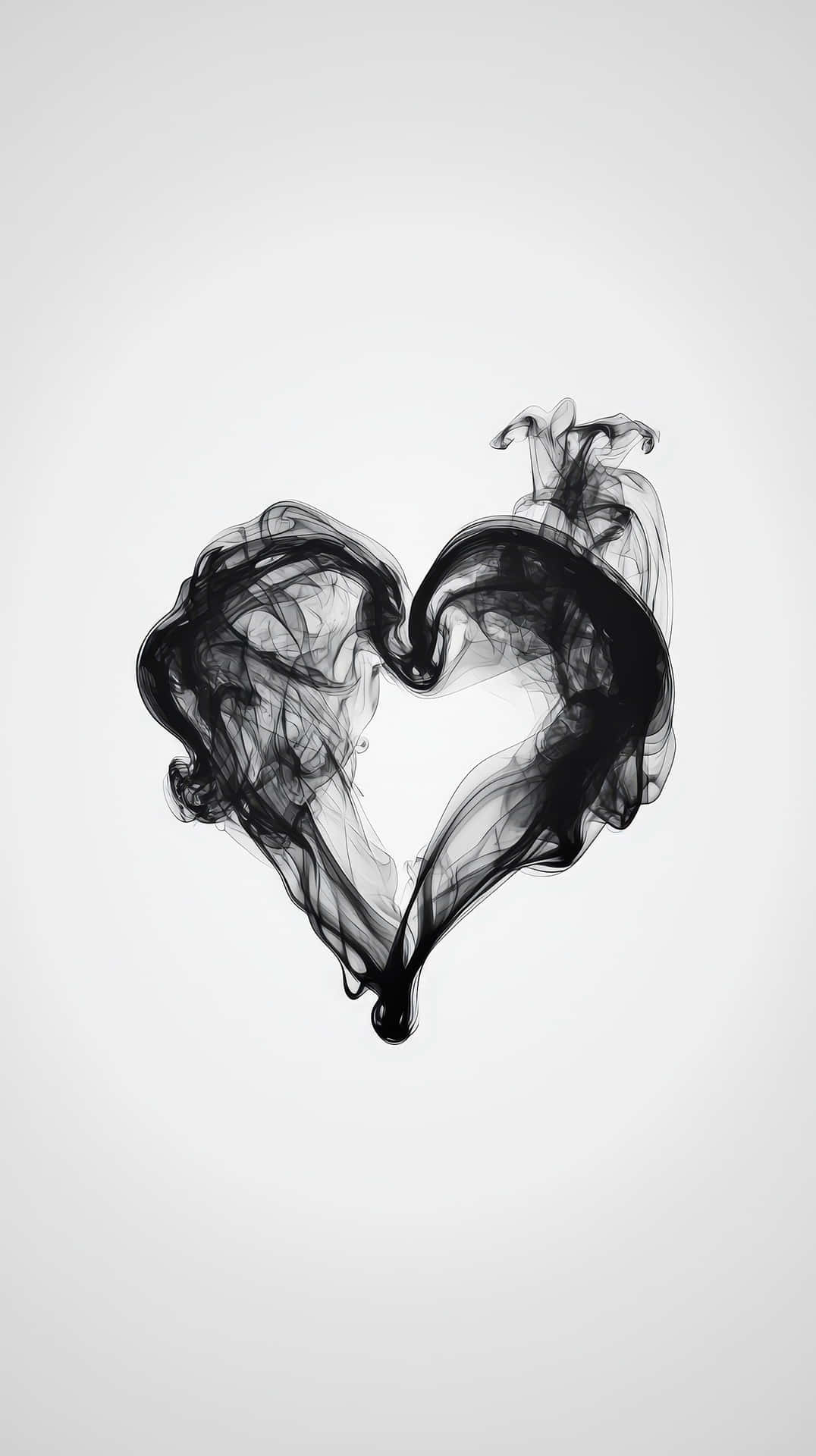 Black Smoke Forming a Heart Shape on White 壁紙 — 一個旋轉的黑色煙霧心形漂浮在柔和的灰色背景上，頂部有精緻的縷縷煙霧。
