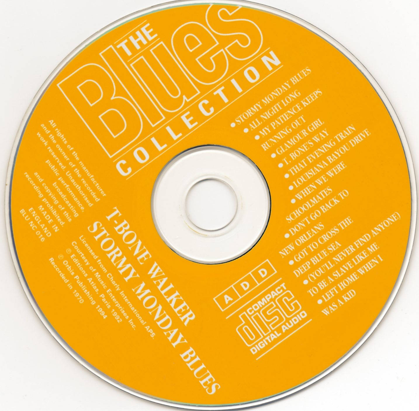 音樂 桌布 壁紙 — 一個明亮的橙色光碟，標有「The Blues Collection」，白色文字列出歌曲和藝術家 T-Bone Walker。