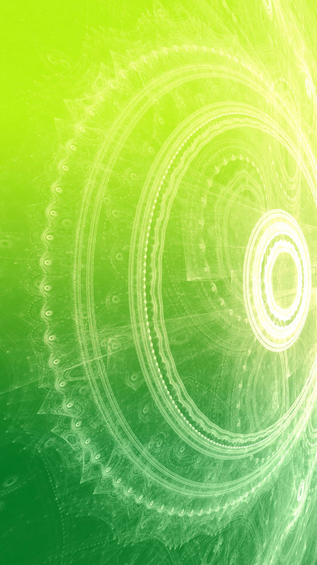 Green Gradient 桌布 壁紙 — 一個明亮的綠色碎形曼陀羅，帶有發光的同心圓和從明亮中心輻射出的精緻圖案。