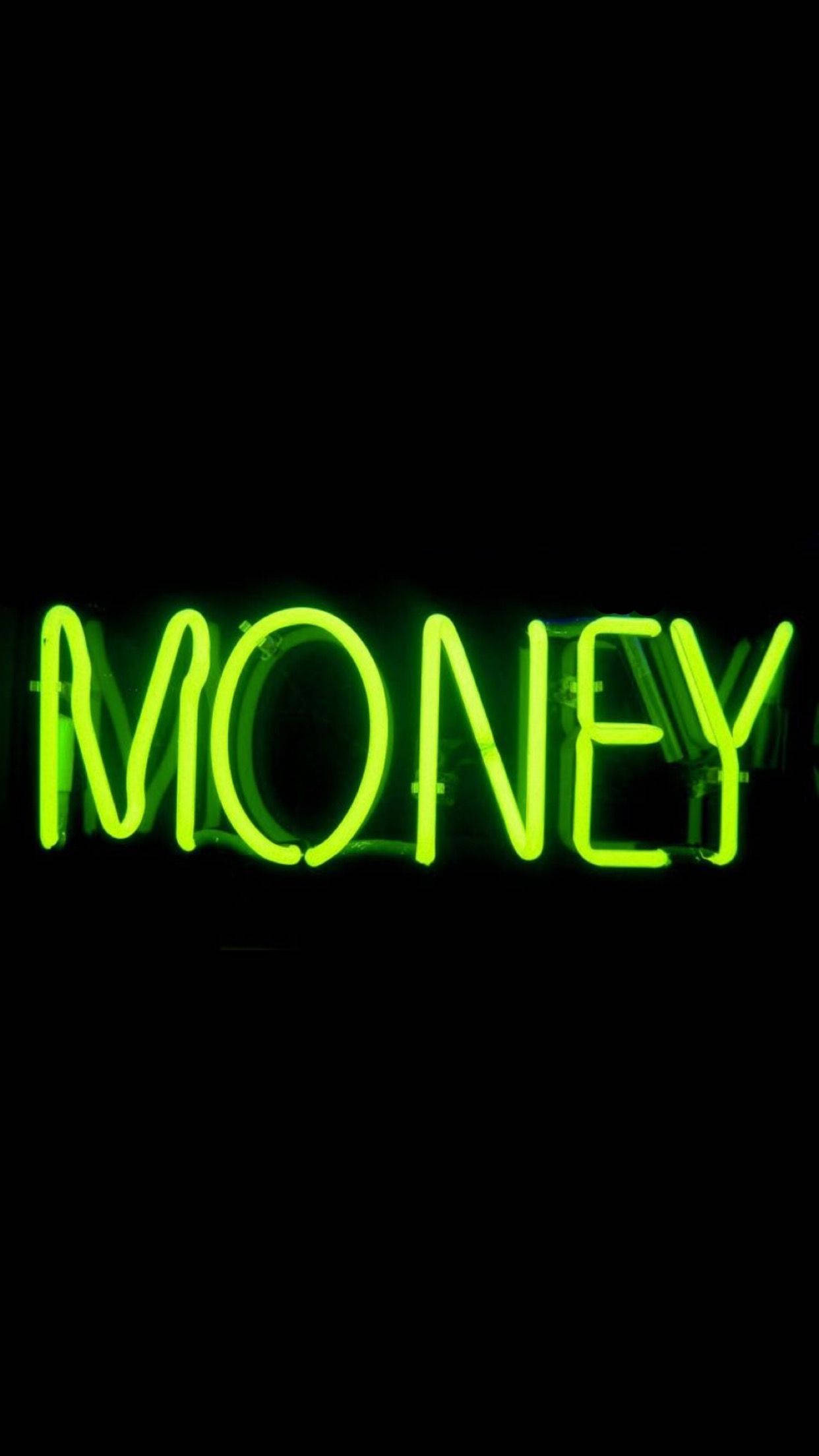 霓虹綠美學 桌布 壁紙 — 一個明亮的綠色霓虹燈牌，拼出「MONEY」，在漆黑的背景下發光。