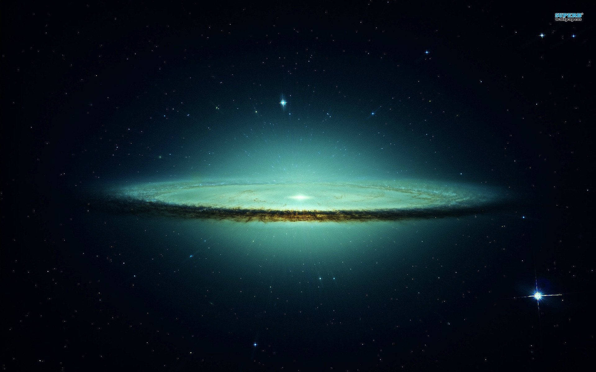 dreamy 桌布 壁紙 — 一個明亮的螺旋星系在佈滿星星的宇宙虛空中散發著藍綠色和金色的光芒。