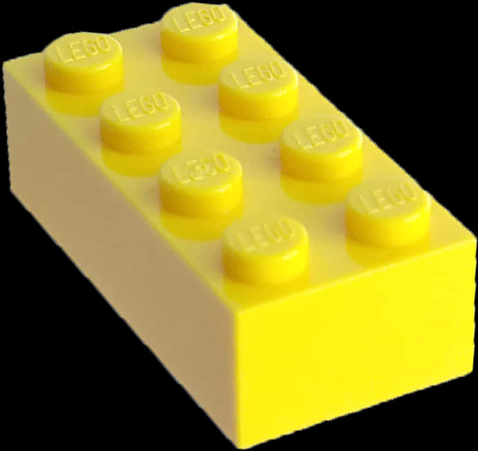 樂高 桌布 壁紙 — 一個明亮的黃色LEGO積木，有八個凸點，孤立地立在純黑色背景上。