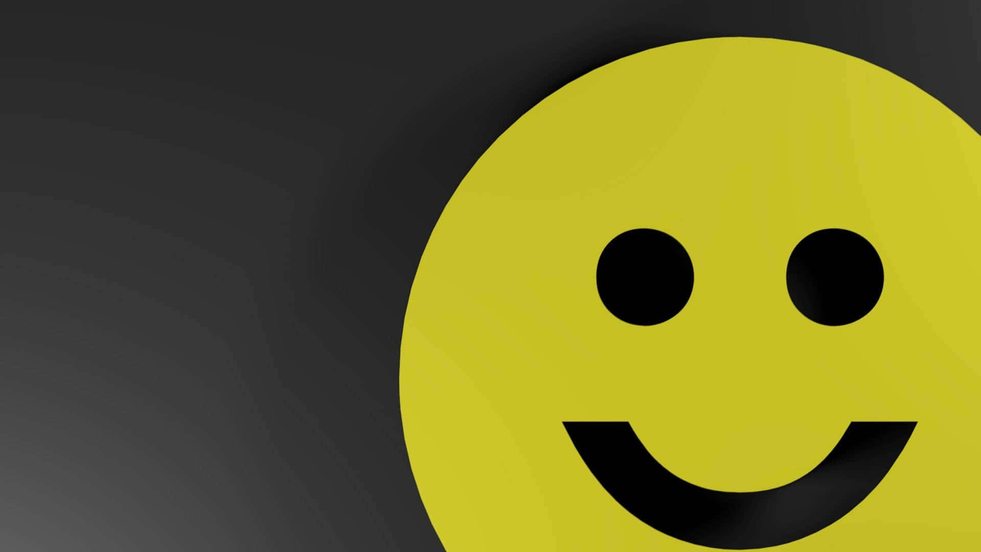 表情符號 桌布 壁紙 — 一個明亮的黃色笑臉，帶有黑色眼睛和嘴巴，在深灰色漸變背景上突出顯示。