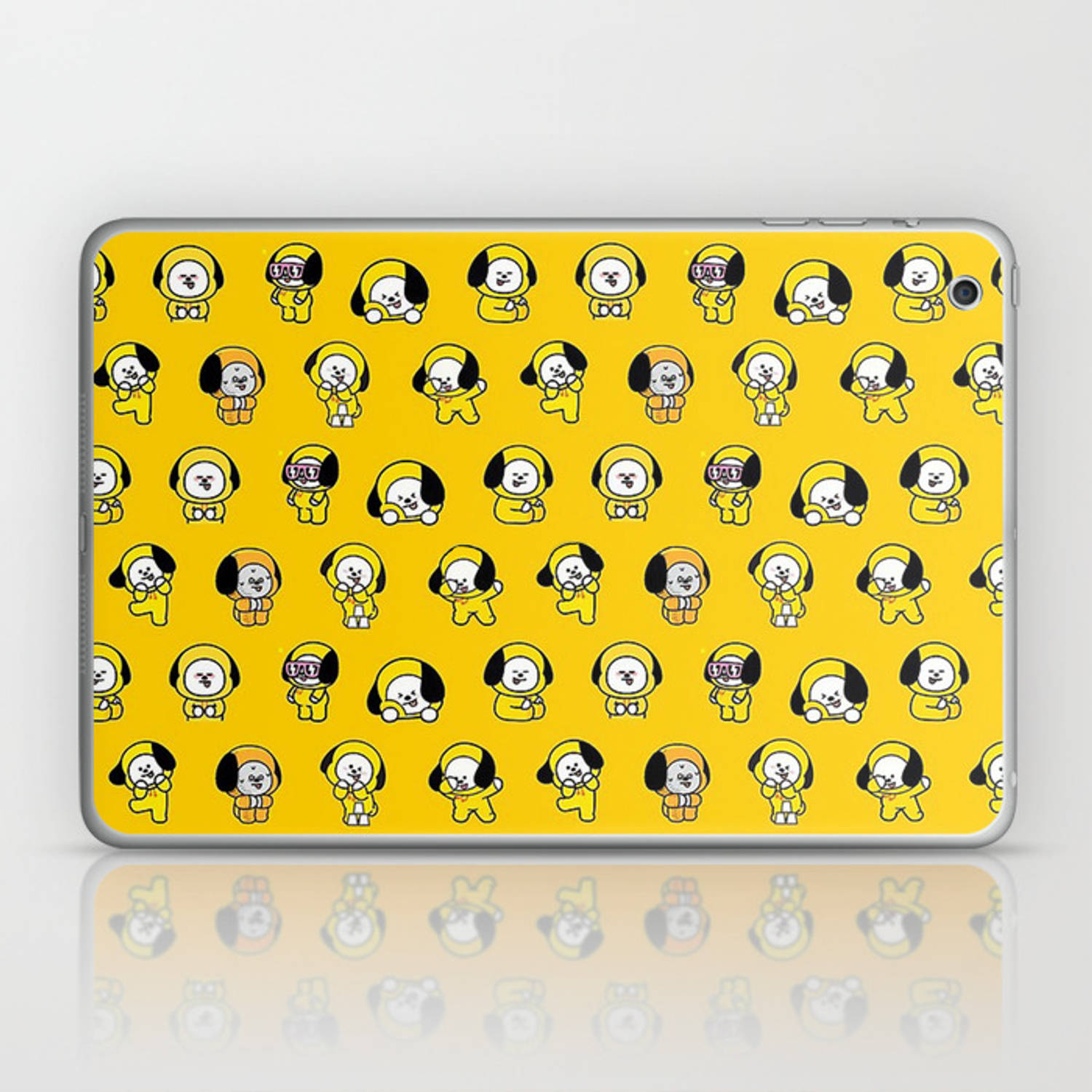 Chimmy 桌布 壁紙 — 一個明亮的黃色筆記型電腦皮膚，上面覆蓋著重複的可愛卡通狗角色，姿勢各異。