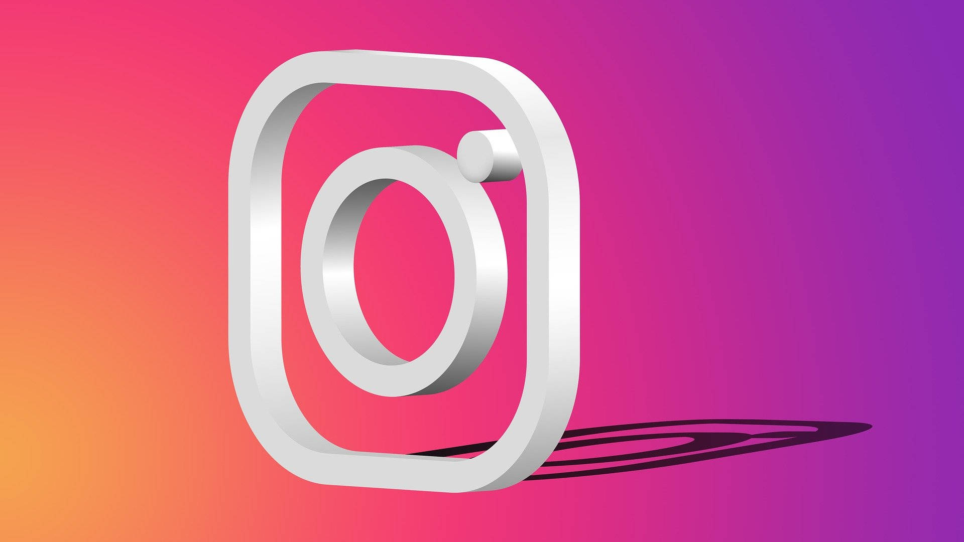 Instagram 桌布 壁紙 — 一個時尚的3D Instagram標誌在粉紅、橙色和紫色的鮮豔漸變背景上投下陰影。