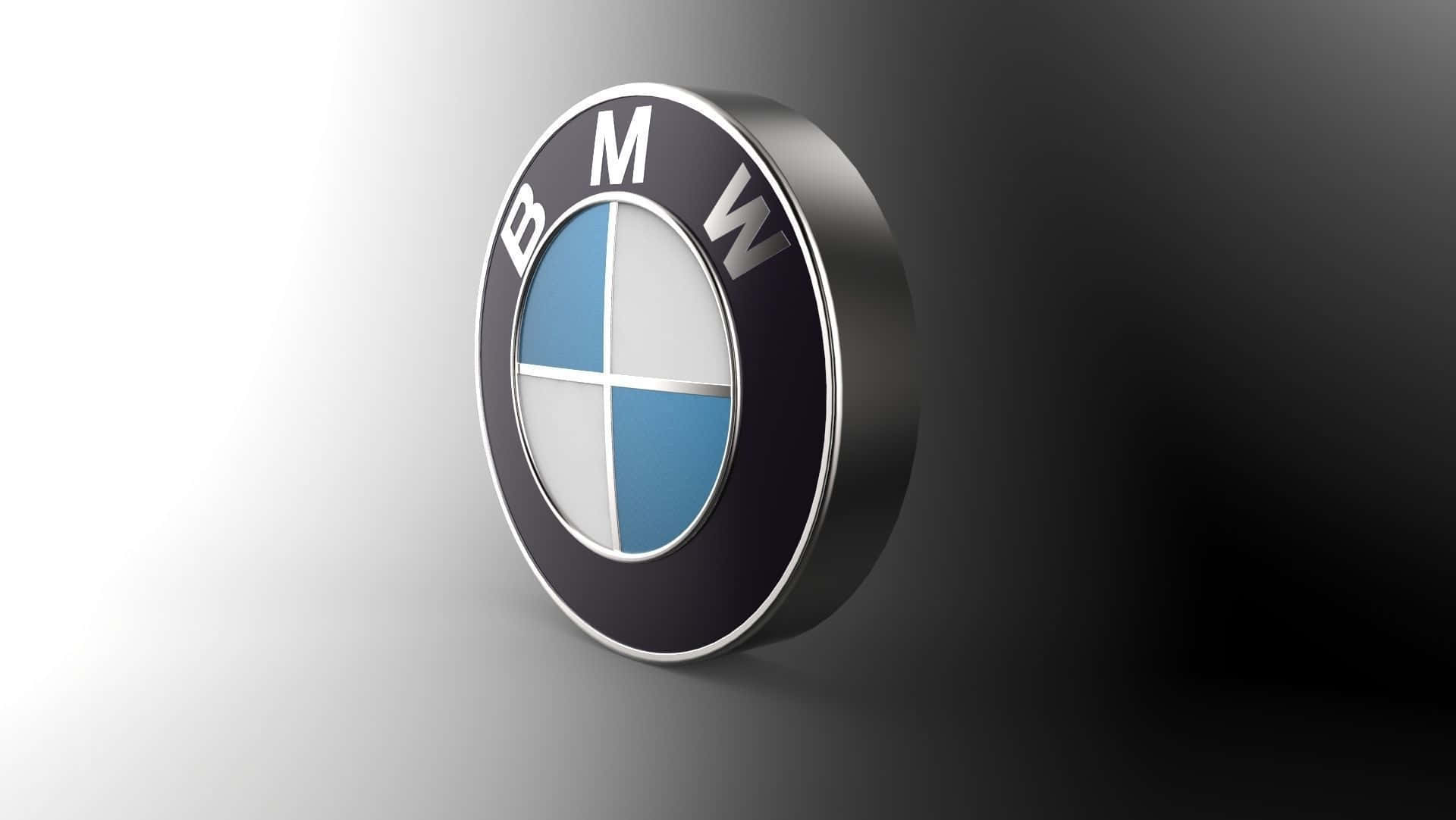 Bmw Tablet 桌布 壁紙 — 一個時尚的3D渲染寶馬標誌，帶有藍色和白色象限，在漸變灰色背景上閃耀。