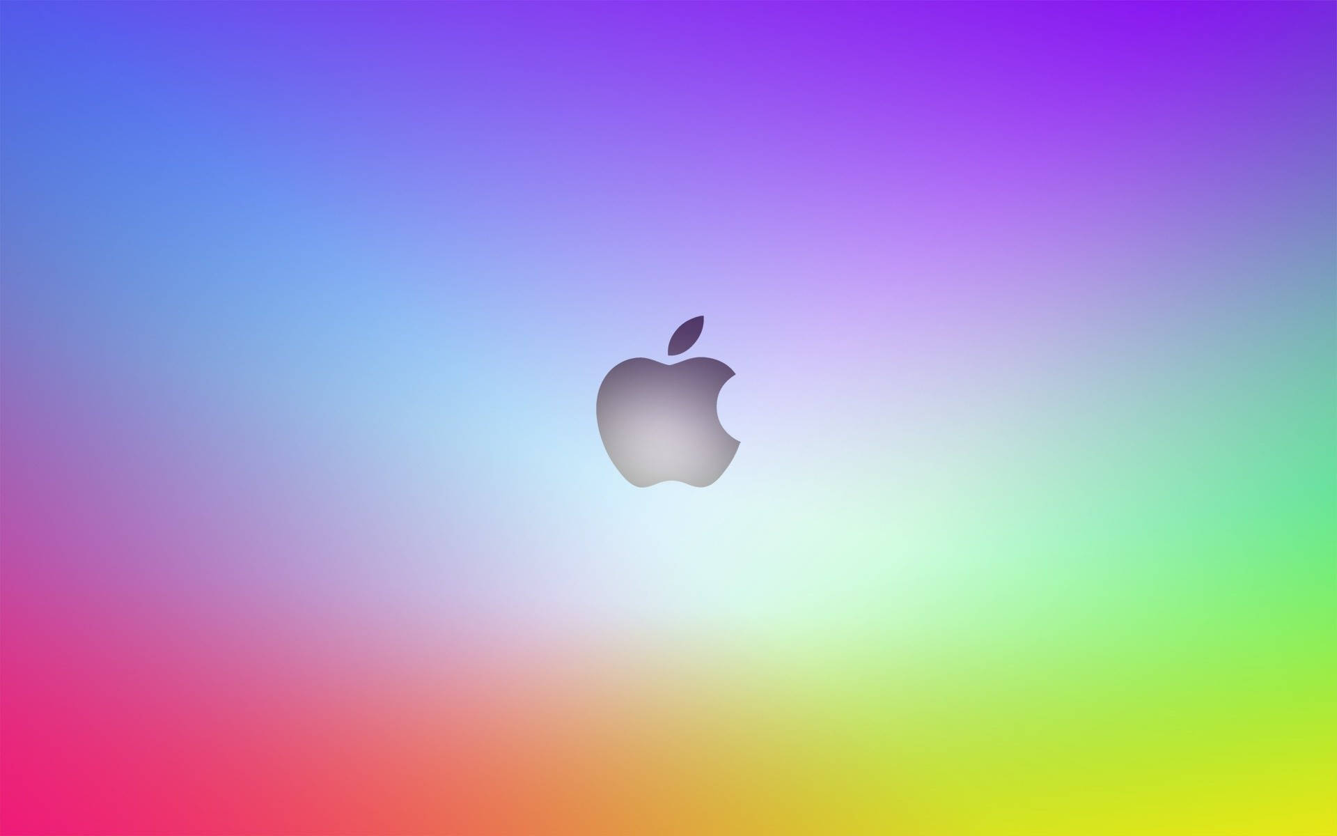 Mac Os 桌布 壁紙 — 一個時尚的Apple標誌，居中於充滿活力的彩虹漸變背景上。