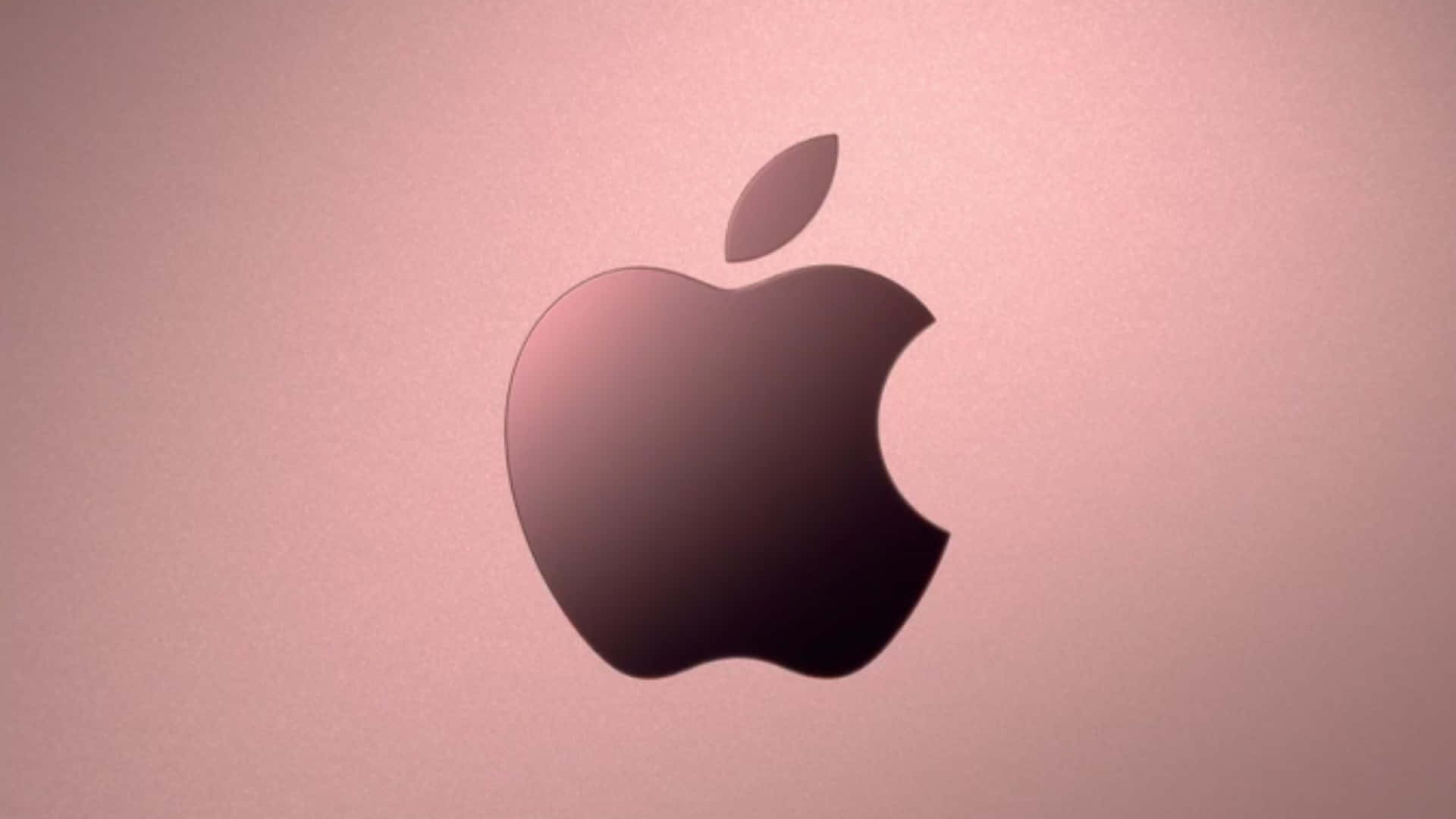 Rose Gold Laptop 桌布 壁紙 — 一個時尚的Apple標誌以深色剪影居中，襯托柔和的玫瑰金漸變背景。