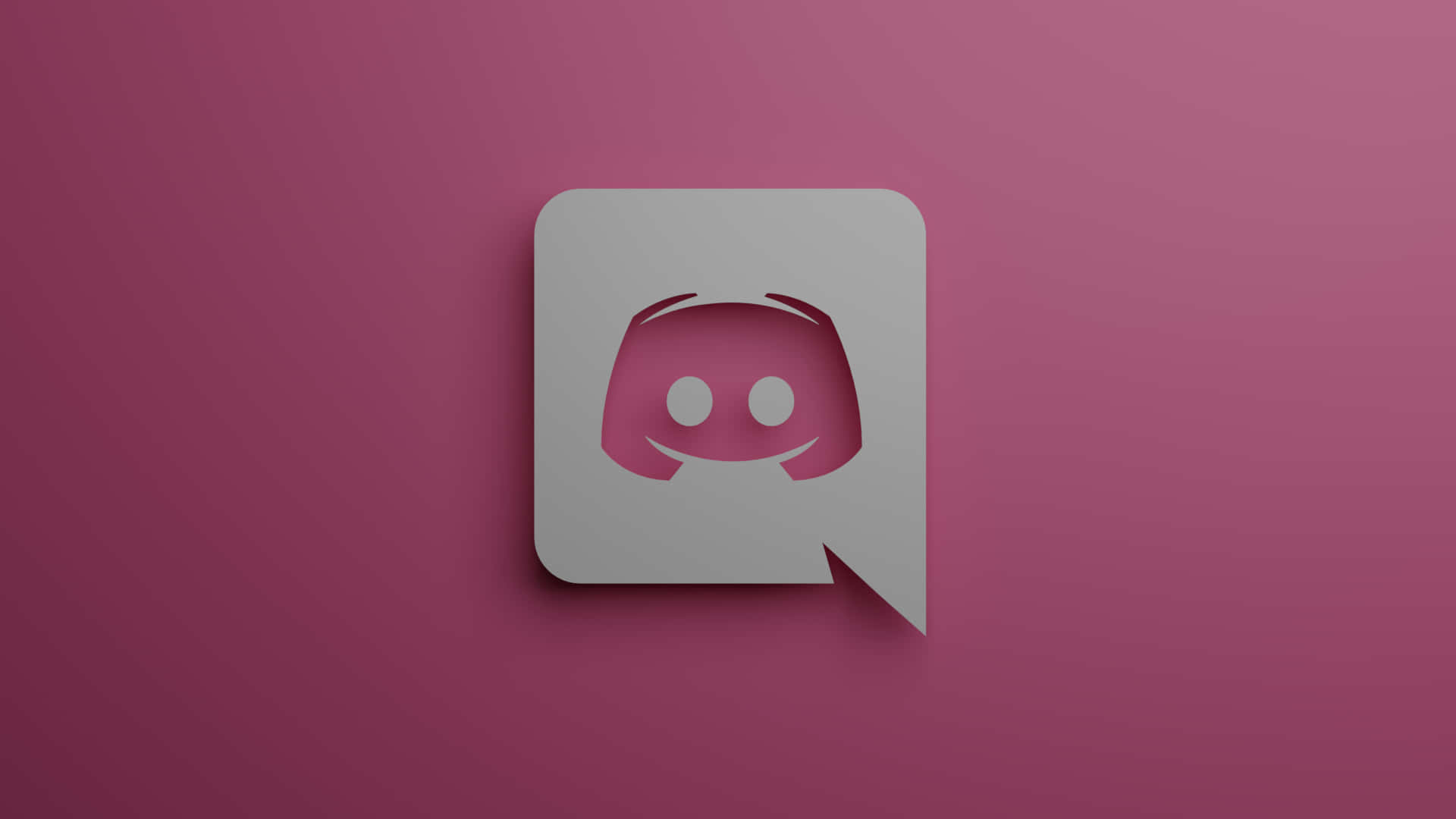 Discord Logo 桌布 壁紙 — 一個時尚的Discord標誌圖示，帶有微笑的臉，居中放置在漸變洋紅色背景上。