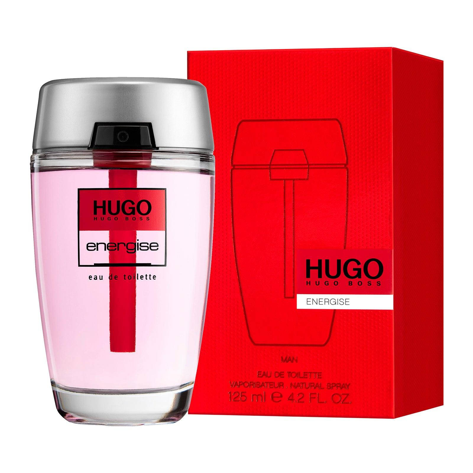 品牌 桌布 壁紙 — 一個時尚的Hugo Boss Energise男士香水瓶，裝有粉紅色液體和銀色瓶蓋，旁邊是其大膽的紅色紋理盒子。