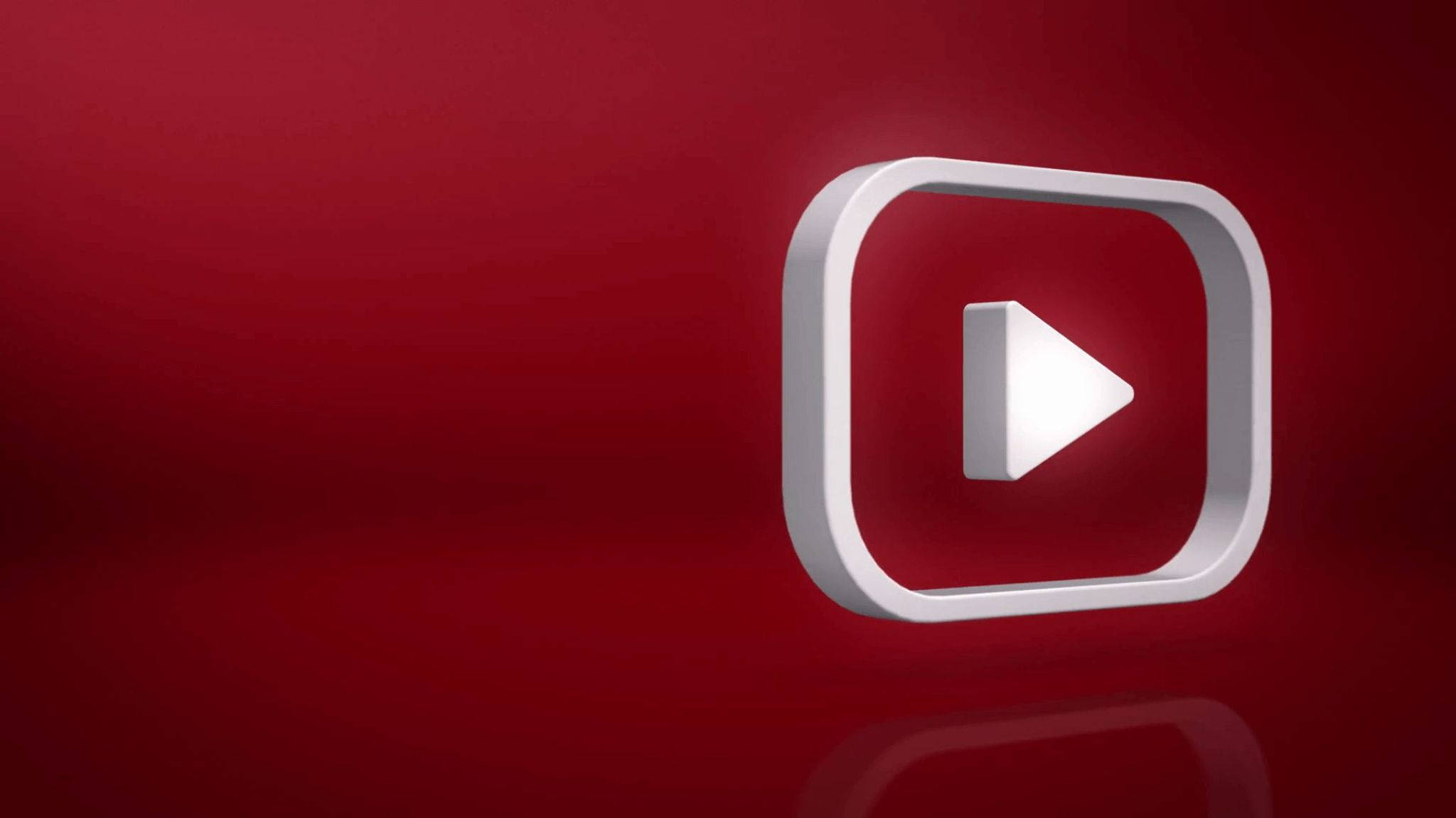 Internet 桌布 壁紙 — 一個時尚的白色YouTube播放按鈕圖示漂浮在豐富的紅色漸變背景上，下方有微妙的倒影。