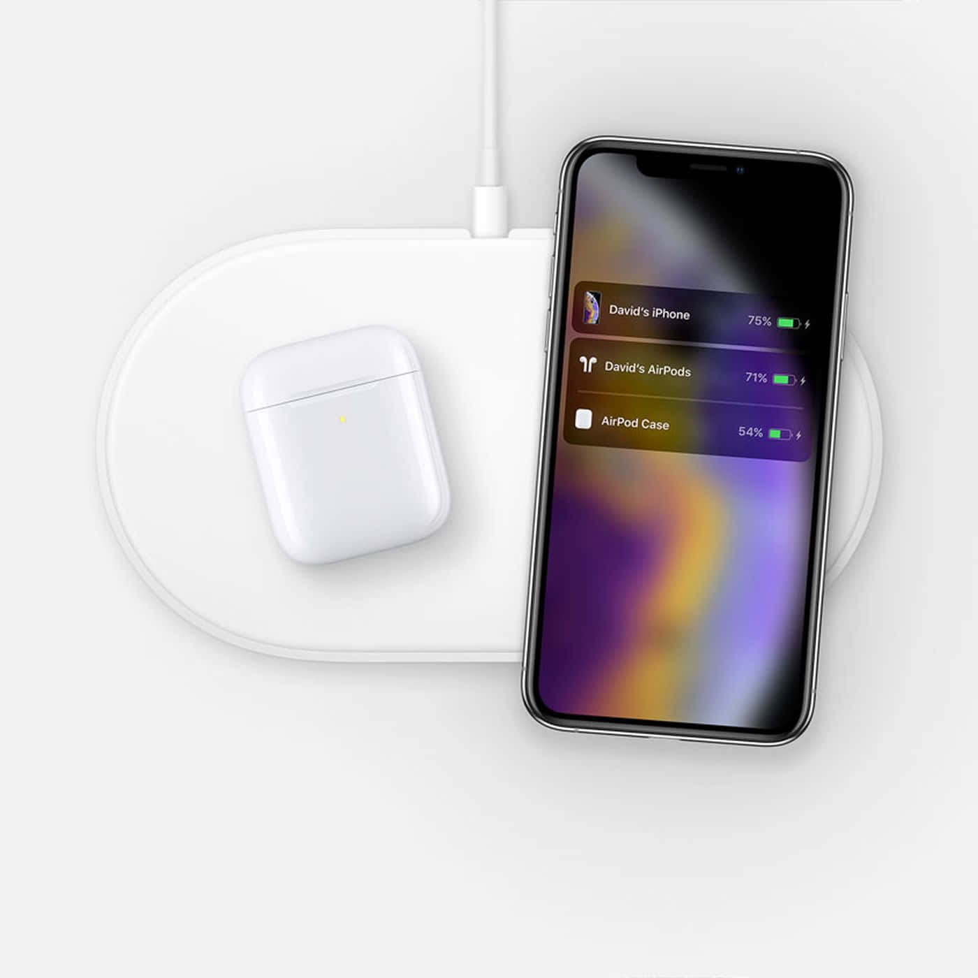 Wireless Charging 桌布 壁紙 — 一個時尚的白色無線充電板，以充滿活力的紫橙色漸變螢幕為iPhone和AirPods充電盒充電。