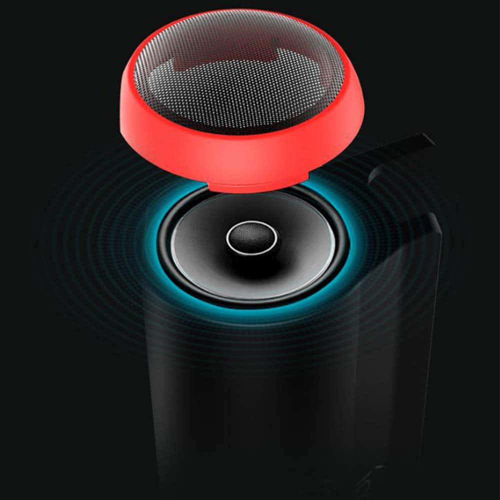 sound wave 桌布 壁紙 — 一個時尚的紅黑便攜式揚聲器，在深色背景下，從其底座散發出發光的藍色聲波。