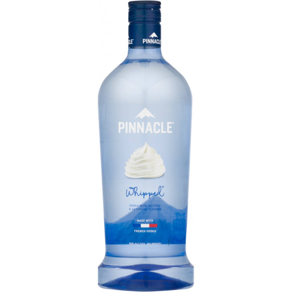 bottle 桌布 壁紙 — 一個時尚的藍色 Pinnacle Whipped 伏特加酒瓶孤立在純白色背景上，標籤上有鮮奶油漩渦和山脈標誌。