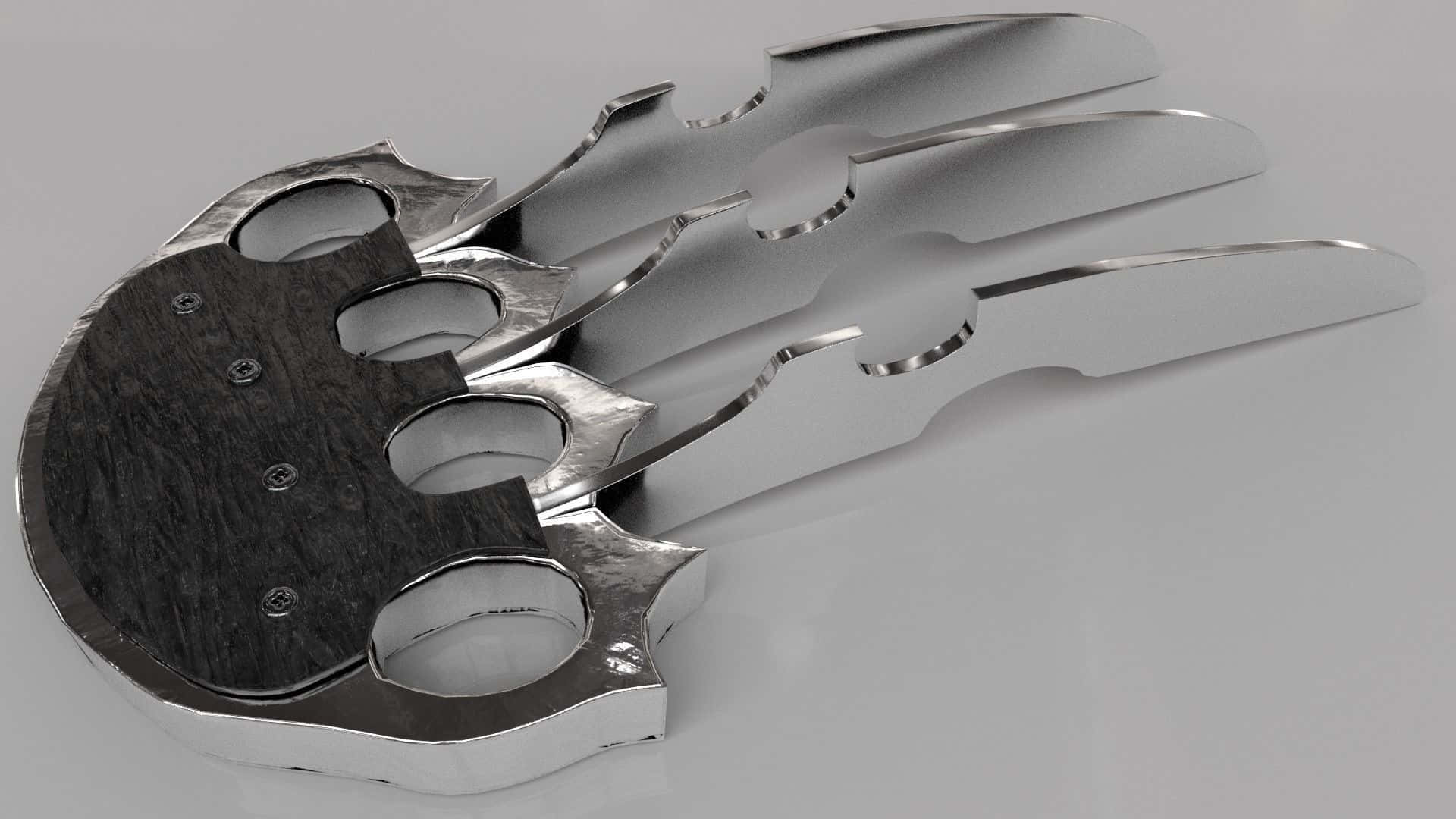 Panther Claws 桌布 壁紙 — 一個時尚的金屬指節銅套，帶有火焰狀延伸部分，放置在純灰色表面上。