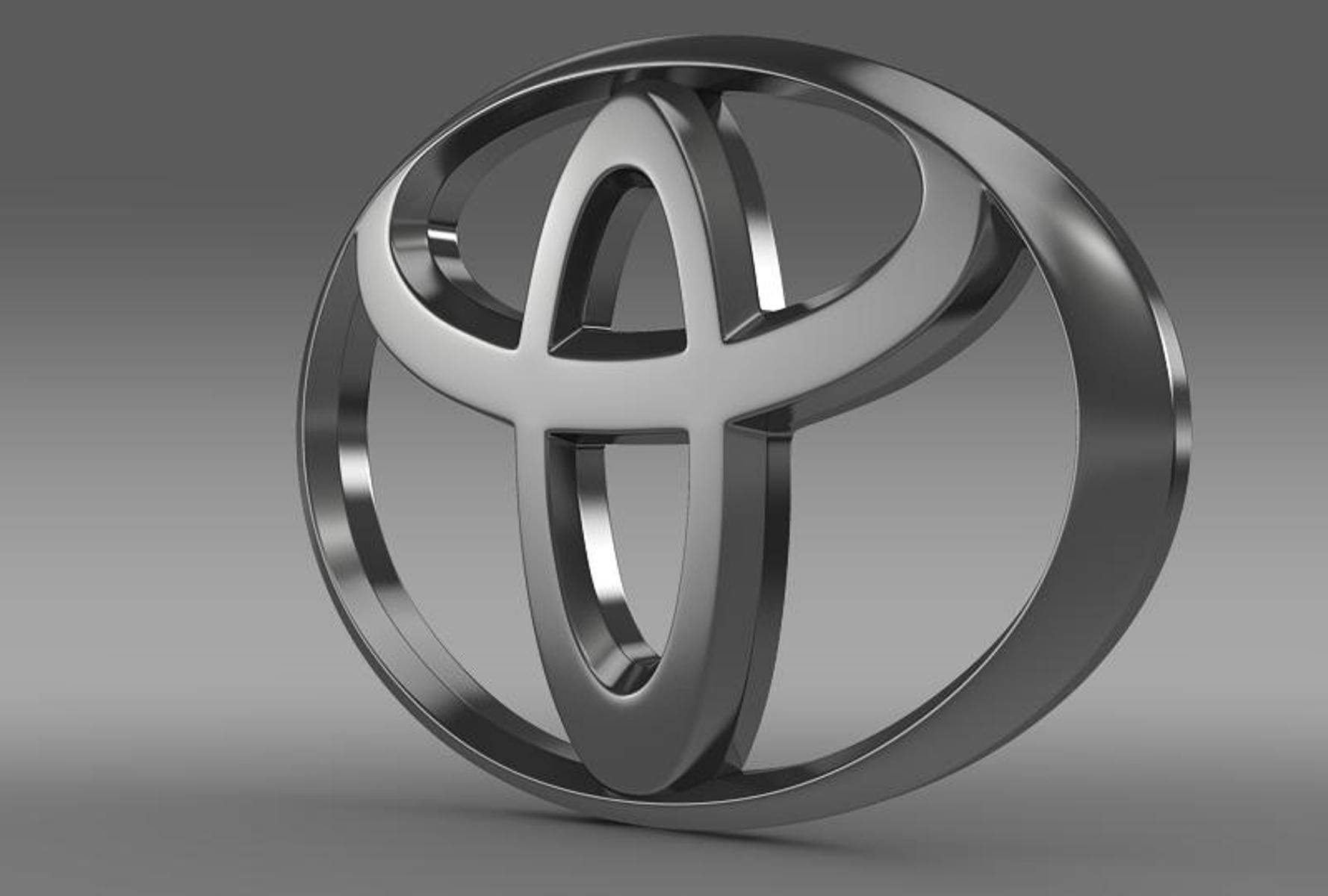 Toyota 桌布 壁紙 — 一個時尚的金屬豐田標誌，以3D渲染，帶有拋光鉻飾面，背景為漸變灰色。