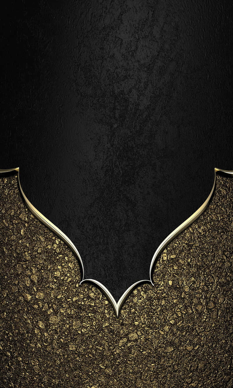 Elegant Black And Gold 桌布 壁紙 — 一個時尚的金色蝙蝠標誌框住一個有紋理的黑色背景，下方有閃爍的金色粒子。