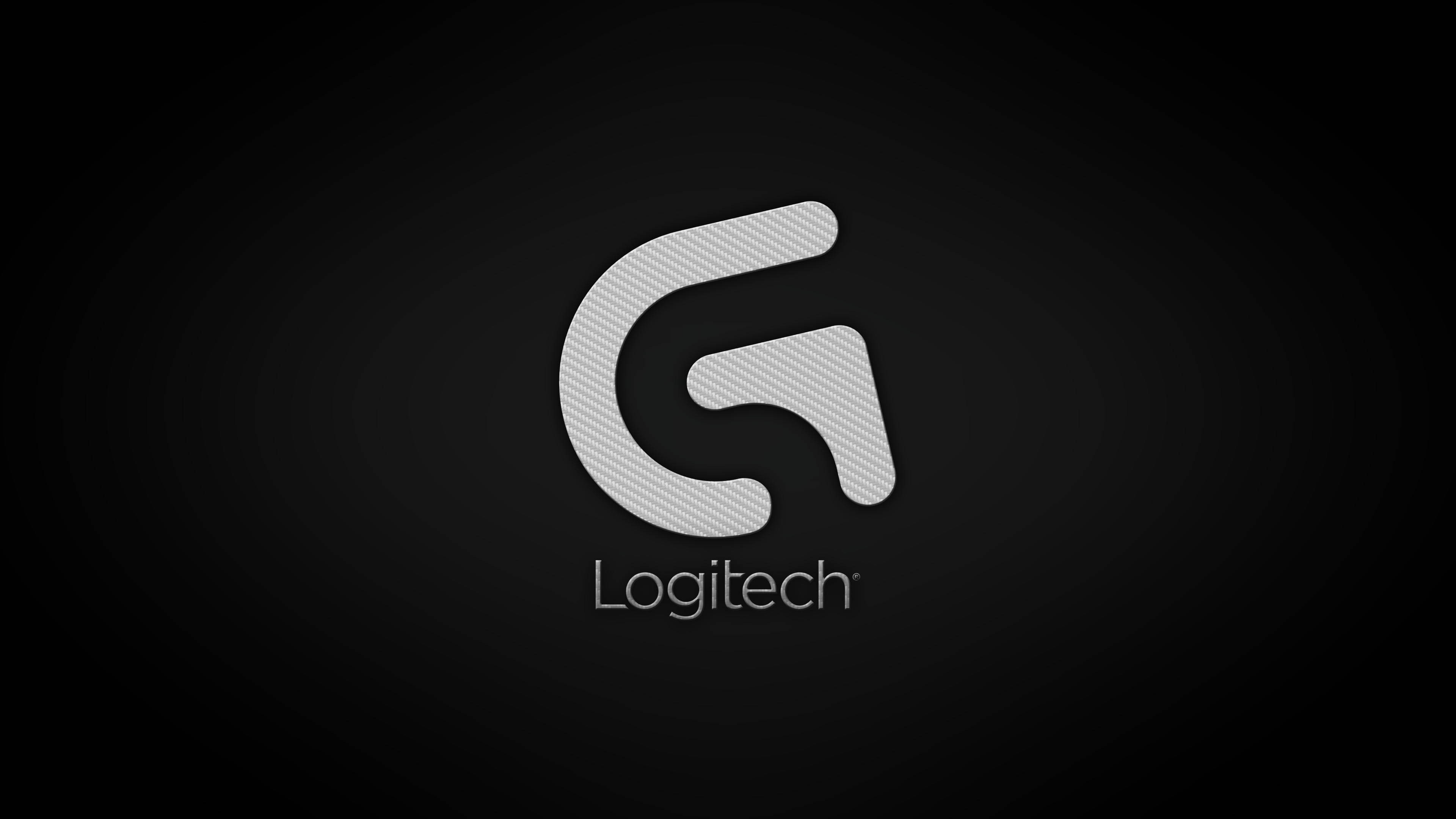 羅技 桌布 壁紙 — 一個時尚的銀色Logitech標誌，帶有碳纖維紋理，居中在深色漸變背景上。