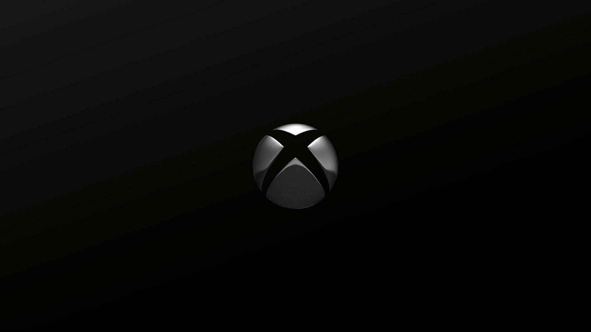 Xbox 桌布 壁紙 — 一個時尚的銀色Xbox標誌，居中放置在漸變黑色背景上，帶有微妙的燈光高光。