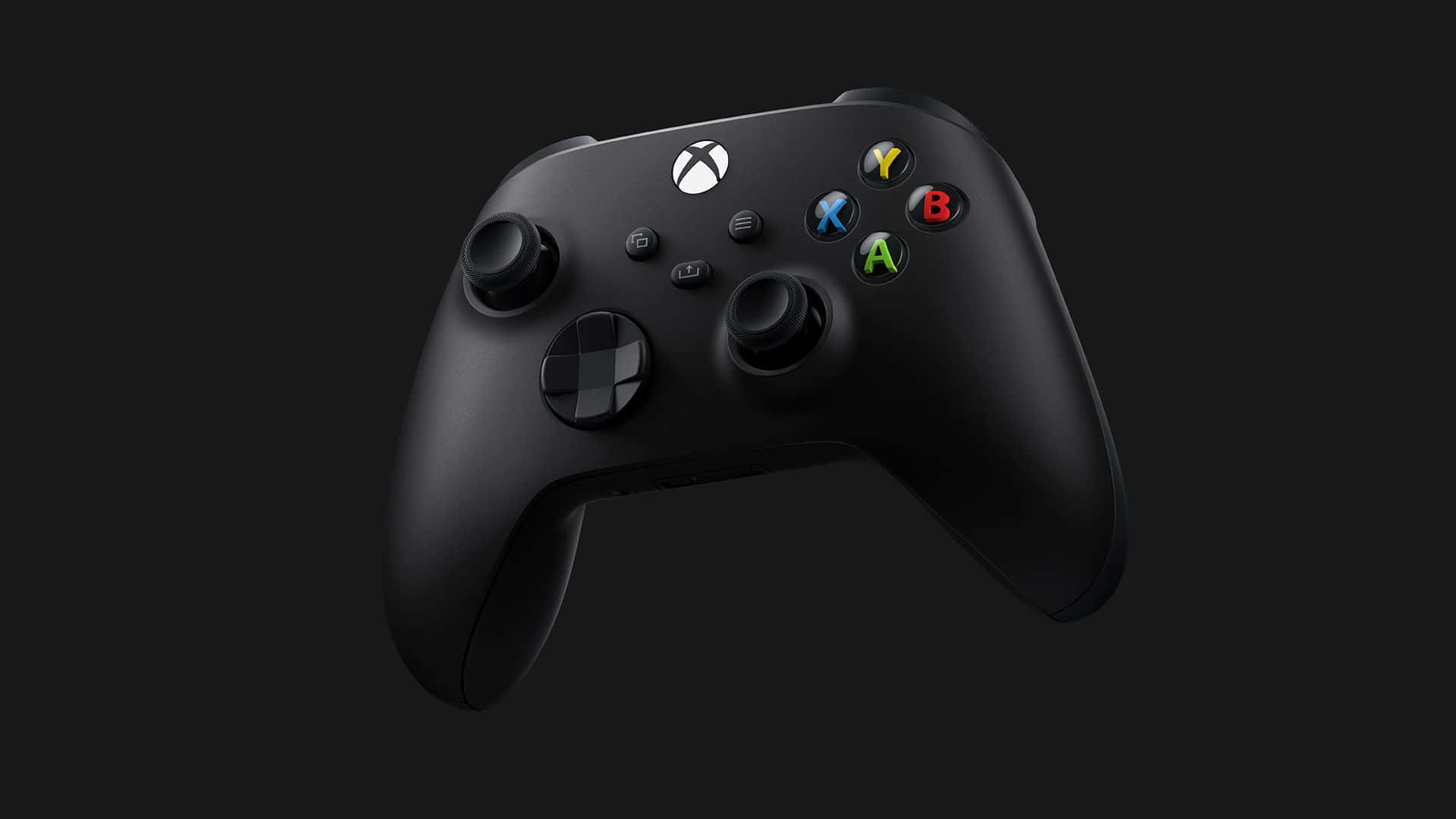 桌布 壁紙 — 一個時尚的霧面黑色Xbox手把漂浮在深色背景上，帶有發光的彩色按鈕。