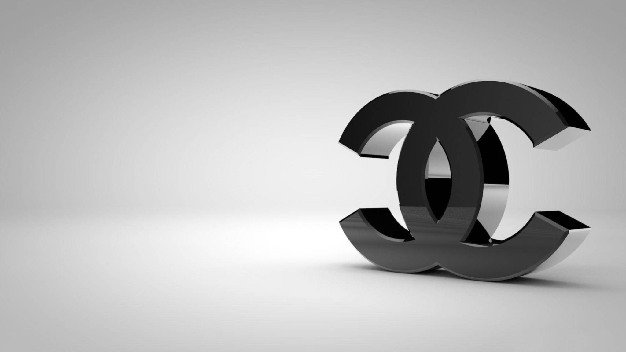 香奈兒標誌 桌布 壁紙 — 一個時尚的黑色 Chanel 標誌在極簡灰色漸變背景上突出顯示。