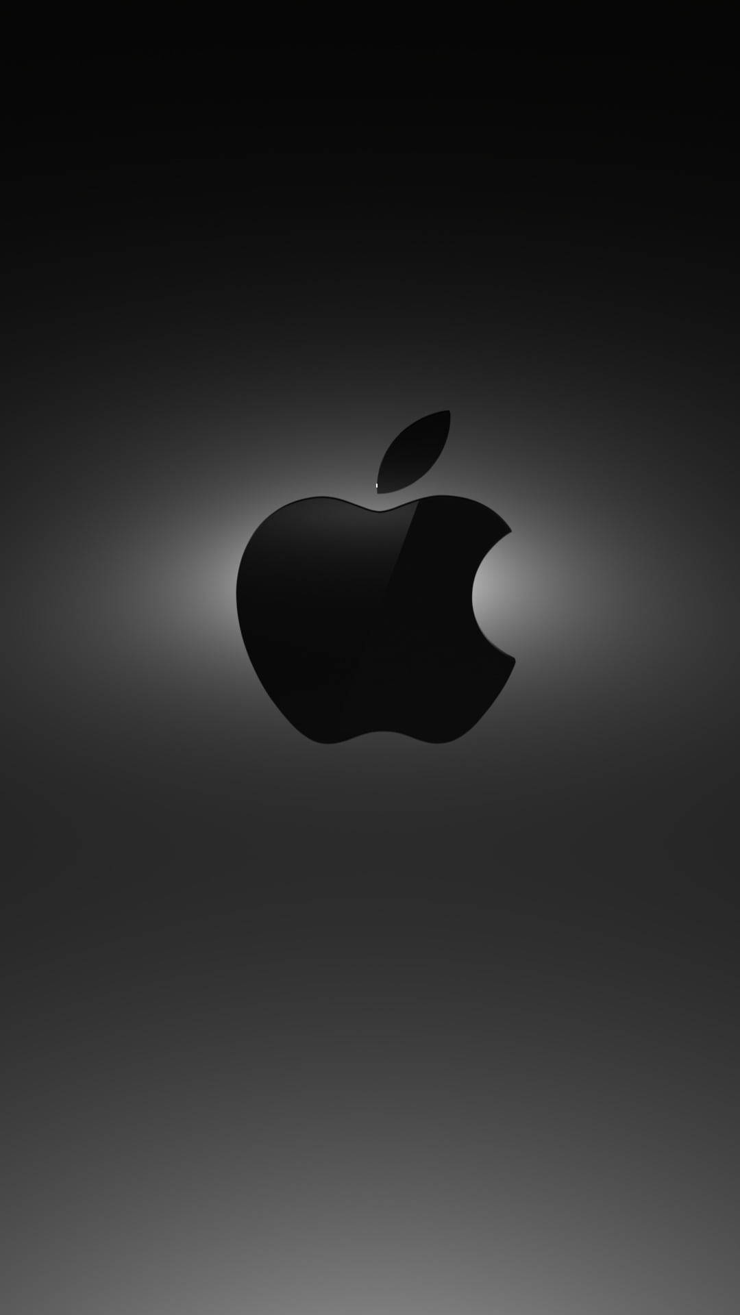 高清 桌布 壁紙 — 一個時尚的黑色Apple標誌，居中放置在帶有柔和發光高光的漸變灰色背景上。