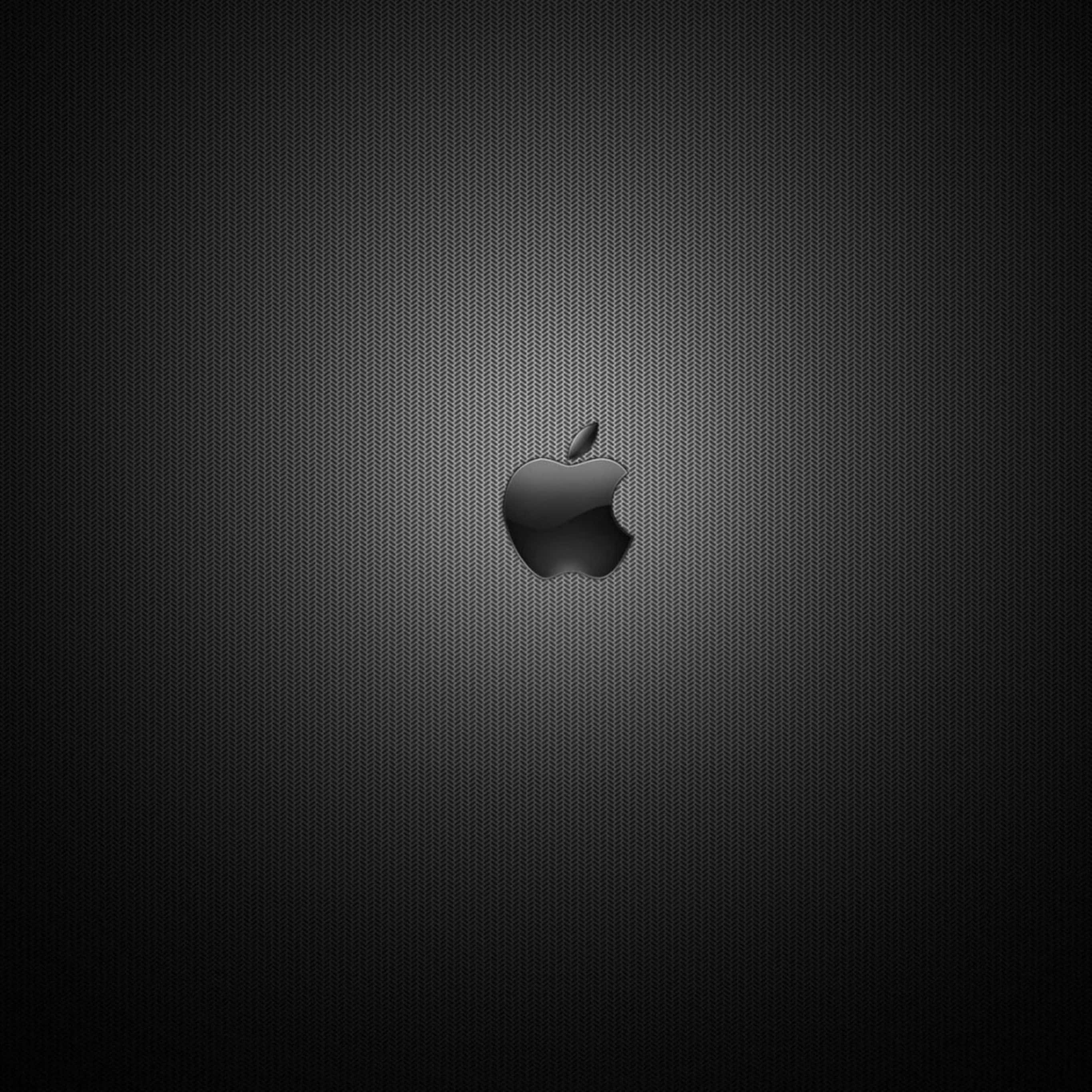 黑色美學 桌布 壁紙 — 一個時尚的黑色Apple標誌，居中於帶紋理的深灰色漸變背景上。