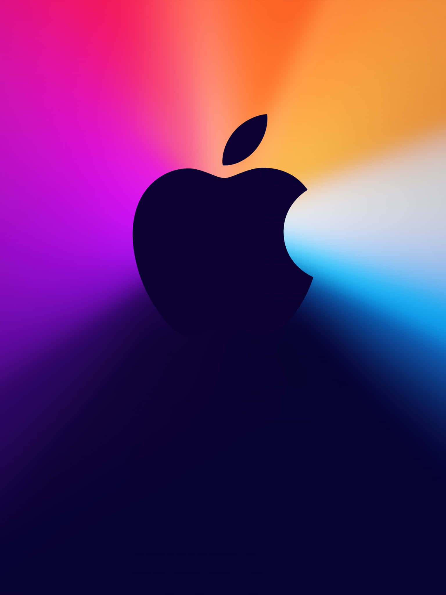 蘋果標誌 桌布 壁紙 — 一個時尚的黑色Apple標誌剪影，矗立在由洋紅色、橙色和藍色組成的耀眼漸變背景前。