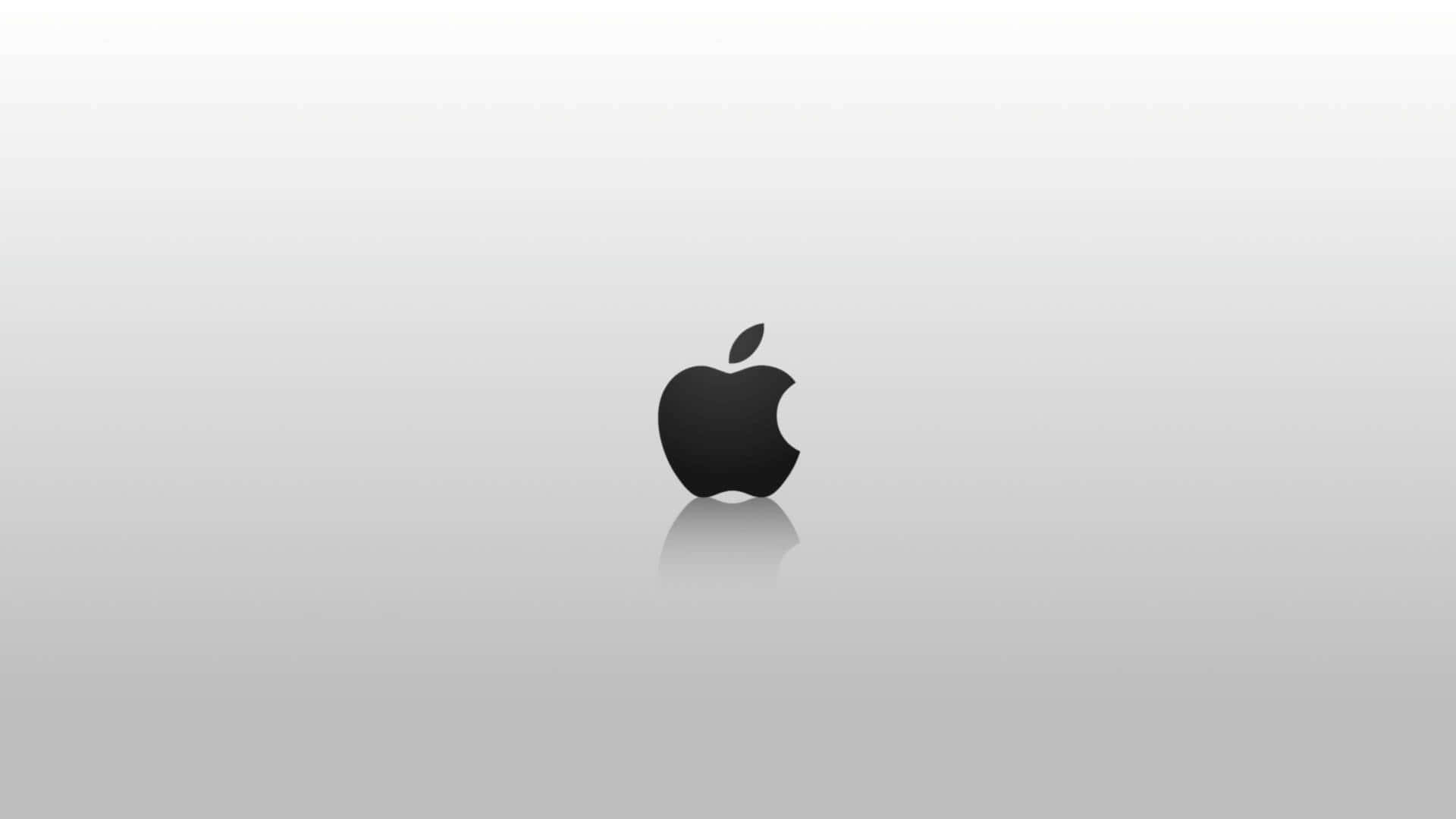 蘋果 桌布 壁紙 — 一個時尚的黑色Apple標誌居中在極簡漸變灰色背景上，帶有微妙的反射。