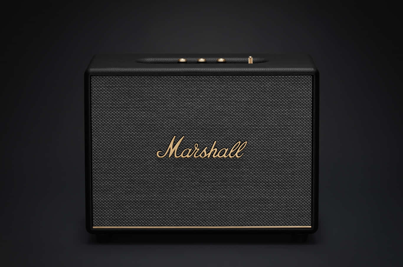 Marshall 桌布 壁紙 — 一個時尚的黑色Marshall揚聲器，帶有金色飾邊和標誌，置於深色漸變背景中央。