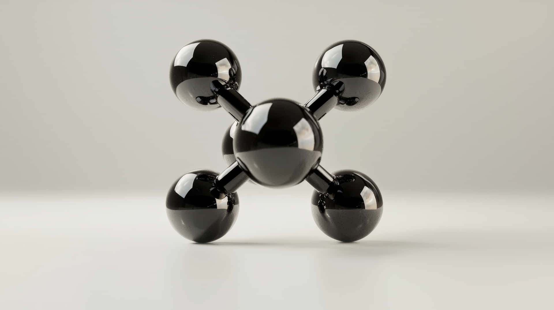 Black Glossy Molecular Structure Model Representing Science and Chemistry on a White Background 壁紙 — 一個時尚的黑色分子模型，帶有光澤球體和棒，位於簡約白色表面中央，背景為柔和灰色。