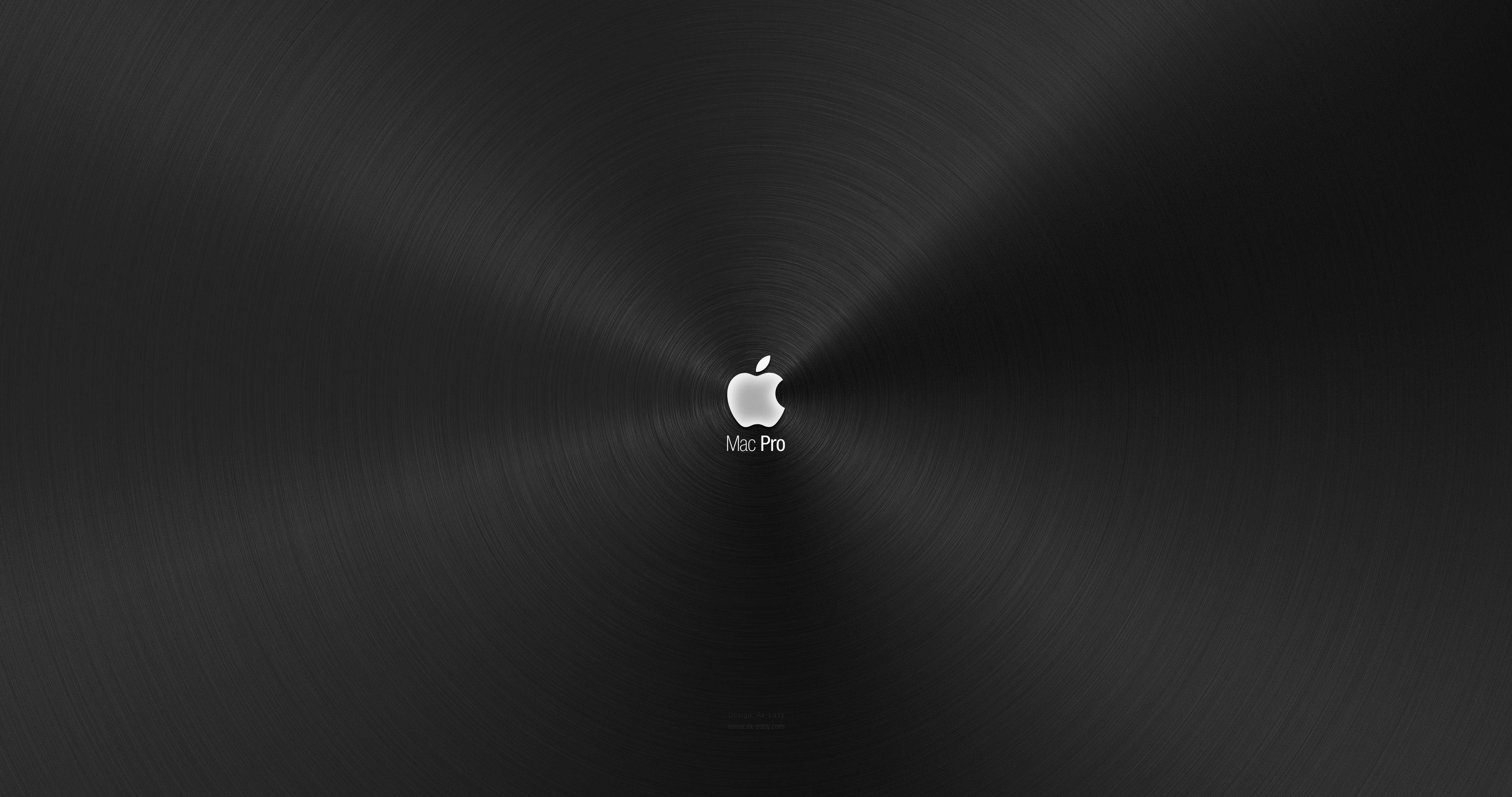MacBook Pro 4K 桌布 壁紙 — 一個時尚的黑色拉絲金屬背景，中央有一個銀色 Apple 標誌和 Mac Pro 文字。