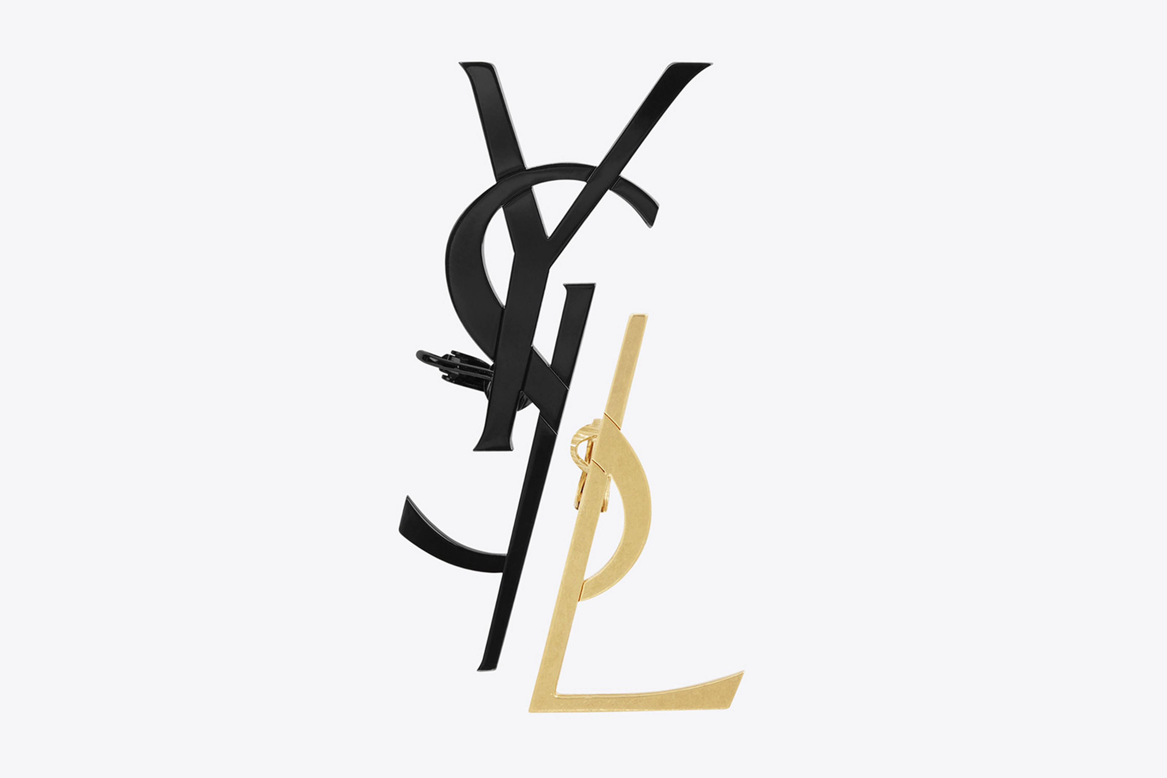 Ysl 桌布 壁紙 — 一個時尚的黑金YSL字母組合標誌，在純白背景上帶有金屬光澤。