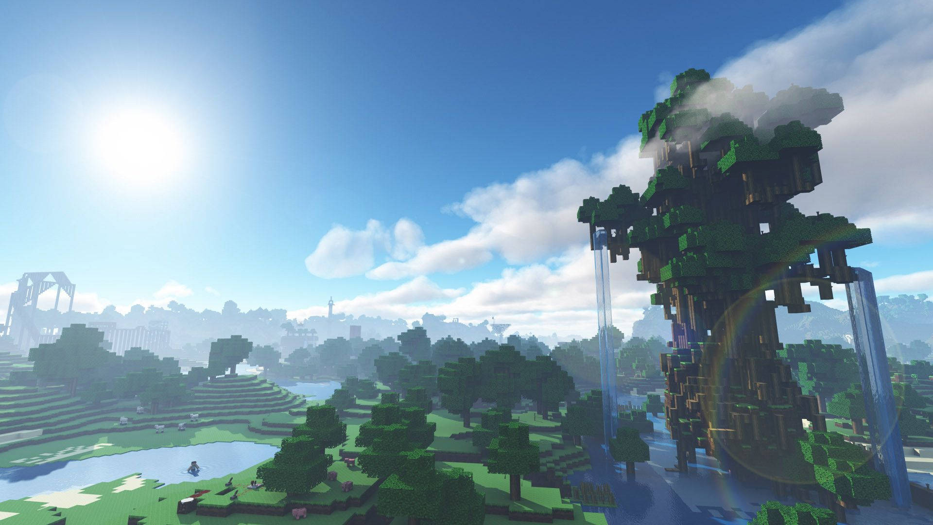 Minecraft Aesthetic 桌布 壁紙 — 一個晴朗的日子，在一個方塊狀的Minecraft世界裡，有一座高聳的樹木，瀑布，以及寧靜的風景，有湖泊和遠處的建築物。