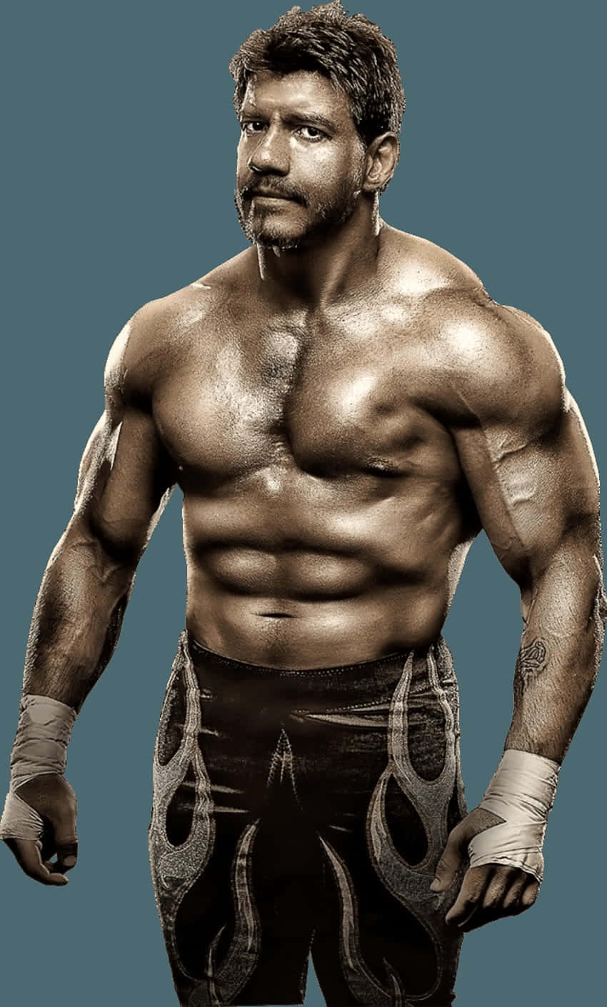 Wrestling 桌布 壁紙 — 一個有鬍鬚和刺青的肌肉男，赤膊站在純青色背景前，穿著火焰圖案的摔角短褲和腕帶。
