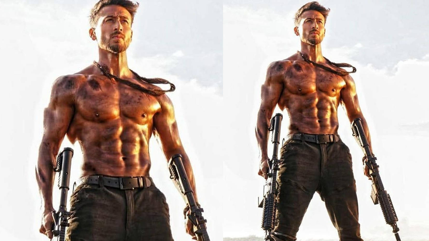 actor 桌布 壁紙 — 一個有鬍鬚的肌肉男赤裸上身，在明亮的天空和雲朵背景下手持步槍。