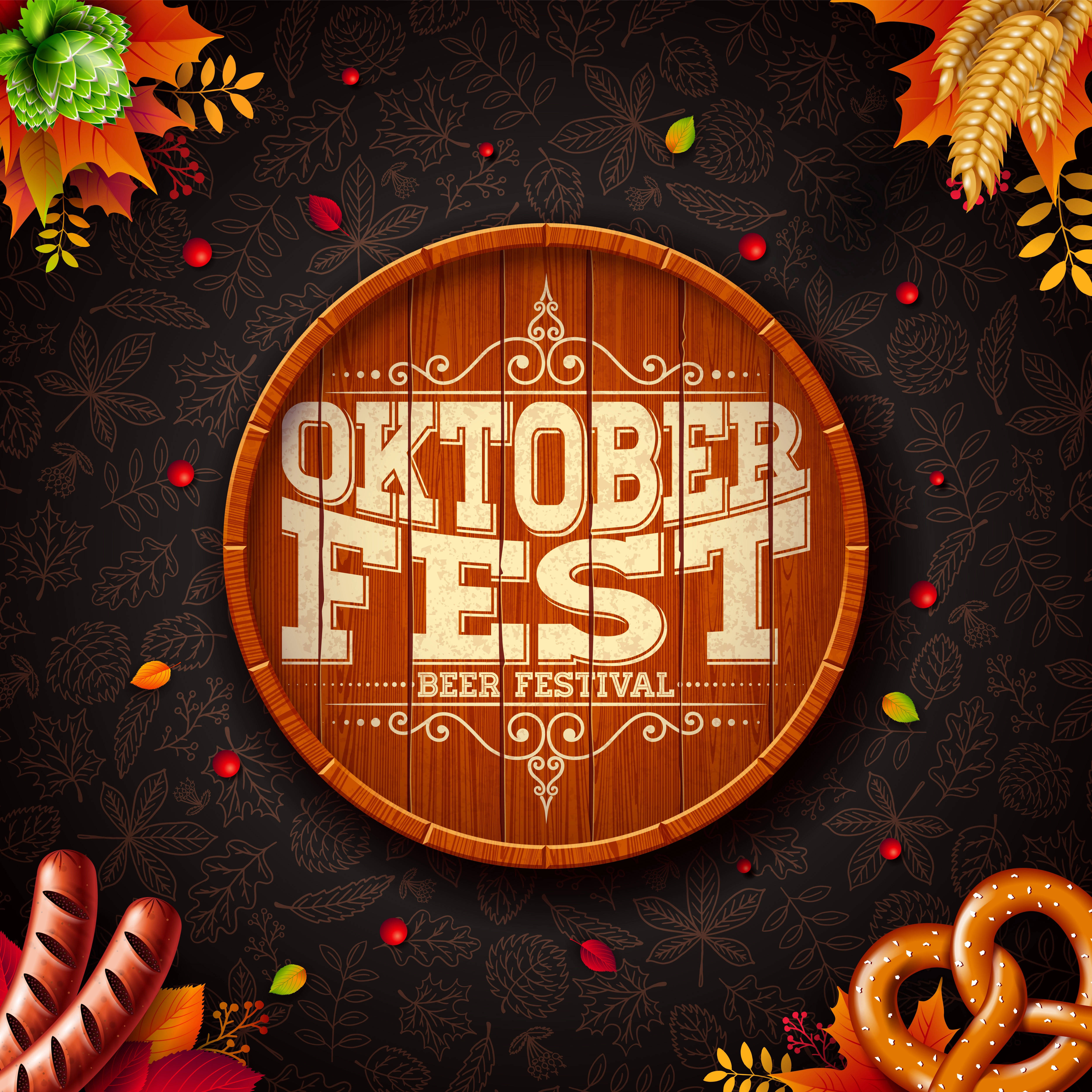 慕尼黑啤酒節 桌布 壁紙 — 一個木桶上寫有「Oktoberfest Beer Festival」字樣，周圍環繞著秋葉、椒鹽卷餅和香腸，背景為深色圖案。