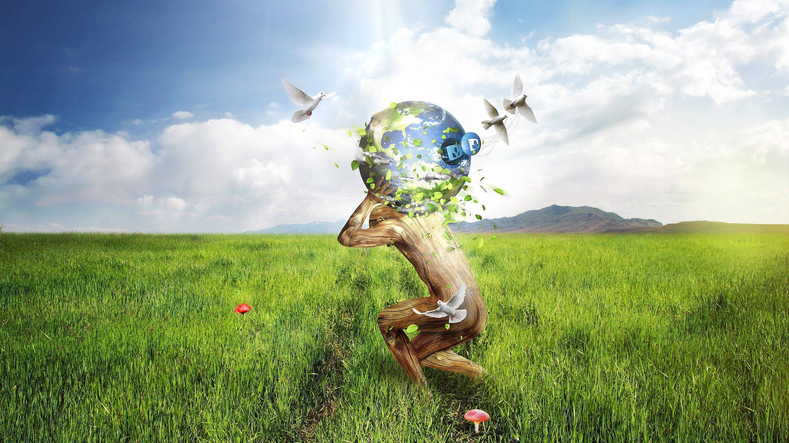 Earth Day 桌布 壁紙 — 一個木製人形雕像在陽光明媚的綠色田野中懷抱著一個地球頭，周圍有白鴿飛翔。