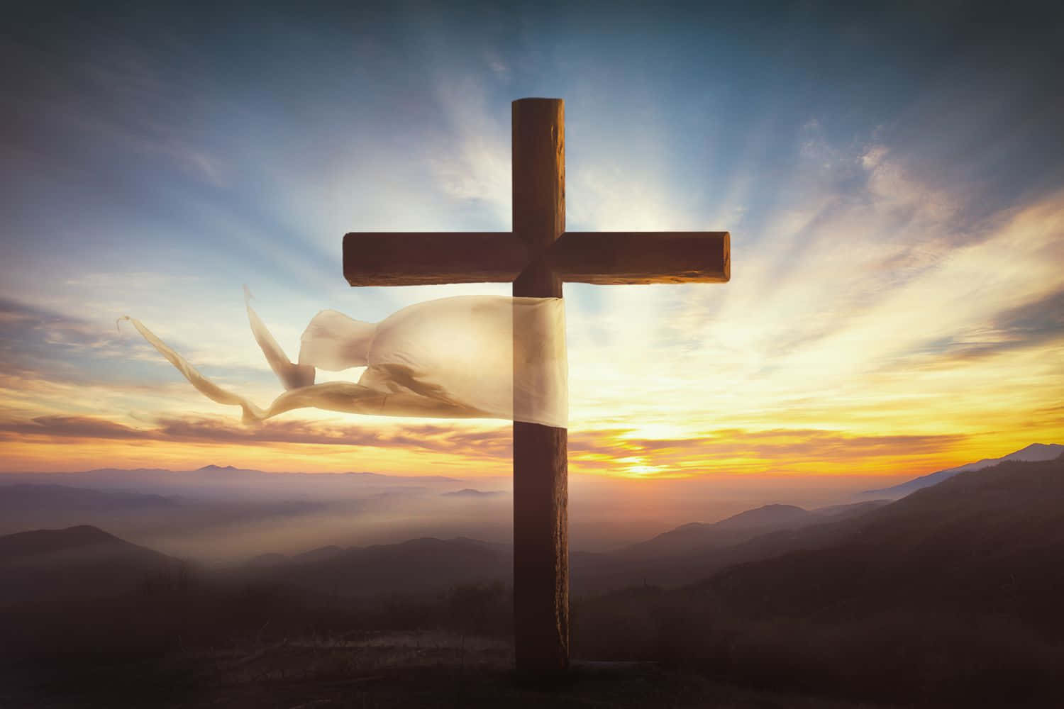 Resurrection 桌布 壁紙 — 一個木製十字架矗立在山頂上，日出時分，一隻白鴿在旁邊飛翔，映襯著充滿活力的橙色和藍色天空。