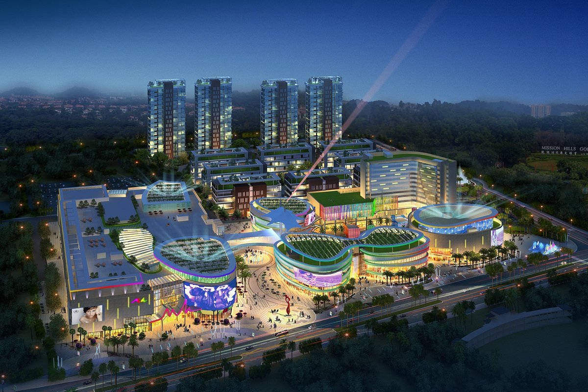 Shenzhen 桌布 壁紙 — 一個未來主義的城市綜合體在夜晚閃耀著霓虹燈和高聳的玻璃摩天大樓，映襯著黑暗的天空。