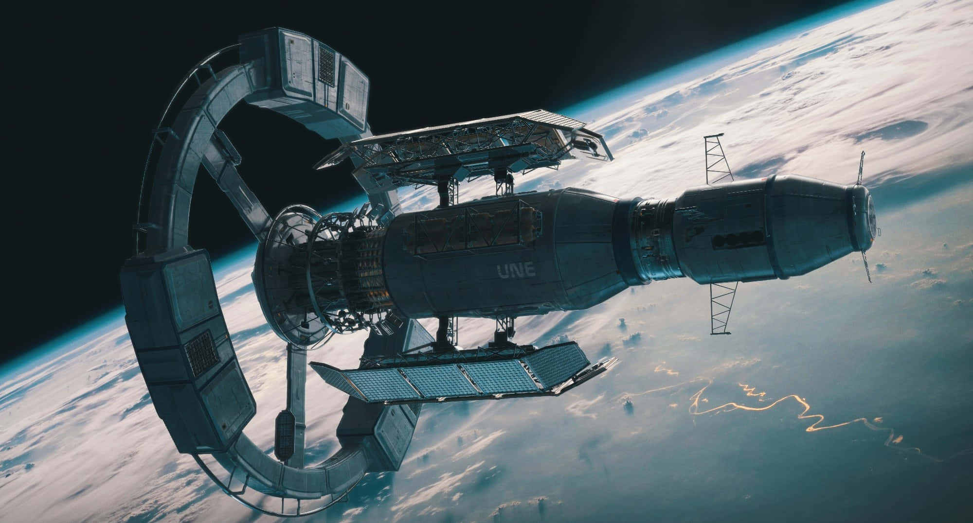 Space Station 桌布 壁紙 — 一個未來主義的太空站繞地球運行，太陽能板展開，背景是藍色的海洋和白色的雲層。