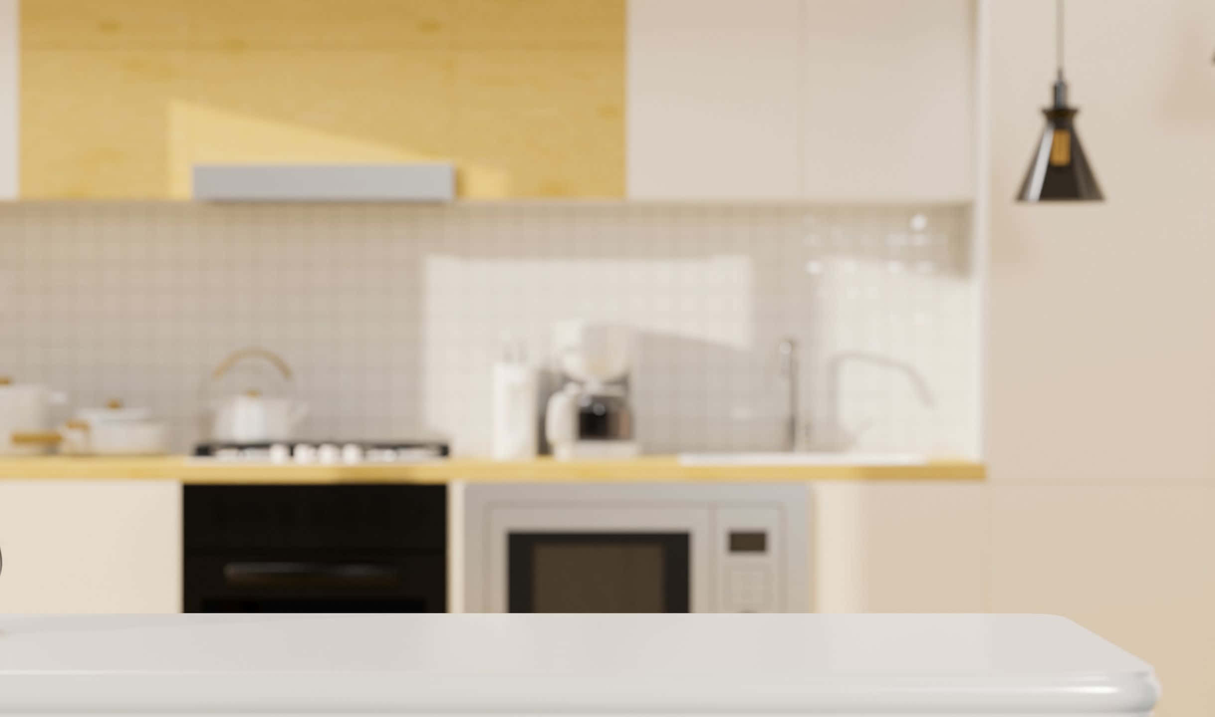 kitchen 桌布 壁紙 — 一個柔和模糊的現代廚房，配有白色櫥櫃、黃色點綴，以及懸掛在白色檯面上方的黑色吊燈。