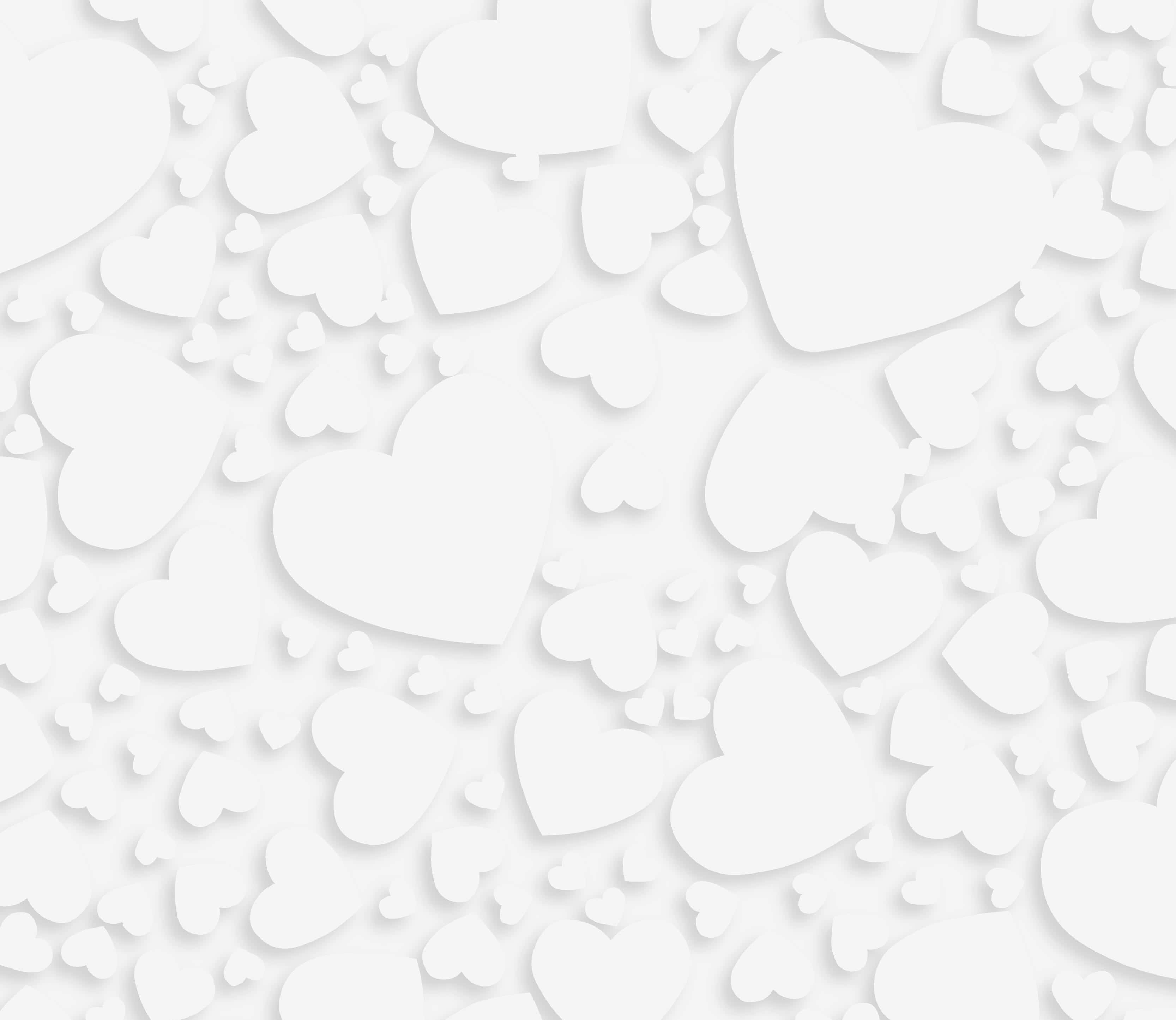White Heart 桌布 壁紙 — 一個柔和白色壁紙圖案，由不同大小的層疊紙心組成，營造出溫柔的紋理背景。