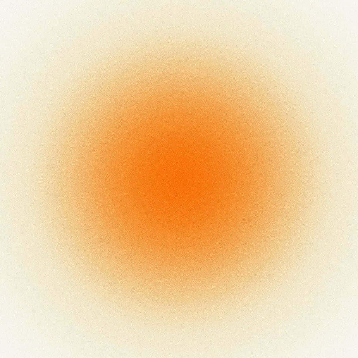 Orange Gradient 桌布 壁紙 — 一個柔和的漸變圓圈在淺奶油色背景上散發出溫暖的橙色色調，帶有細微的紋理。