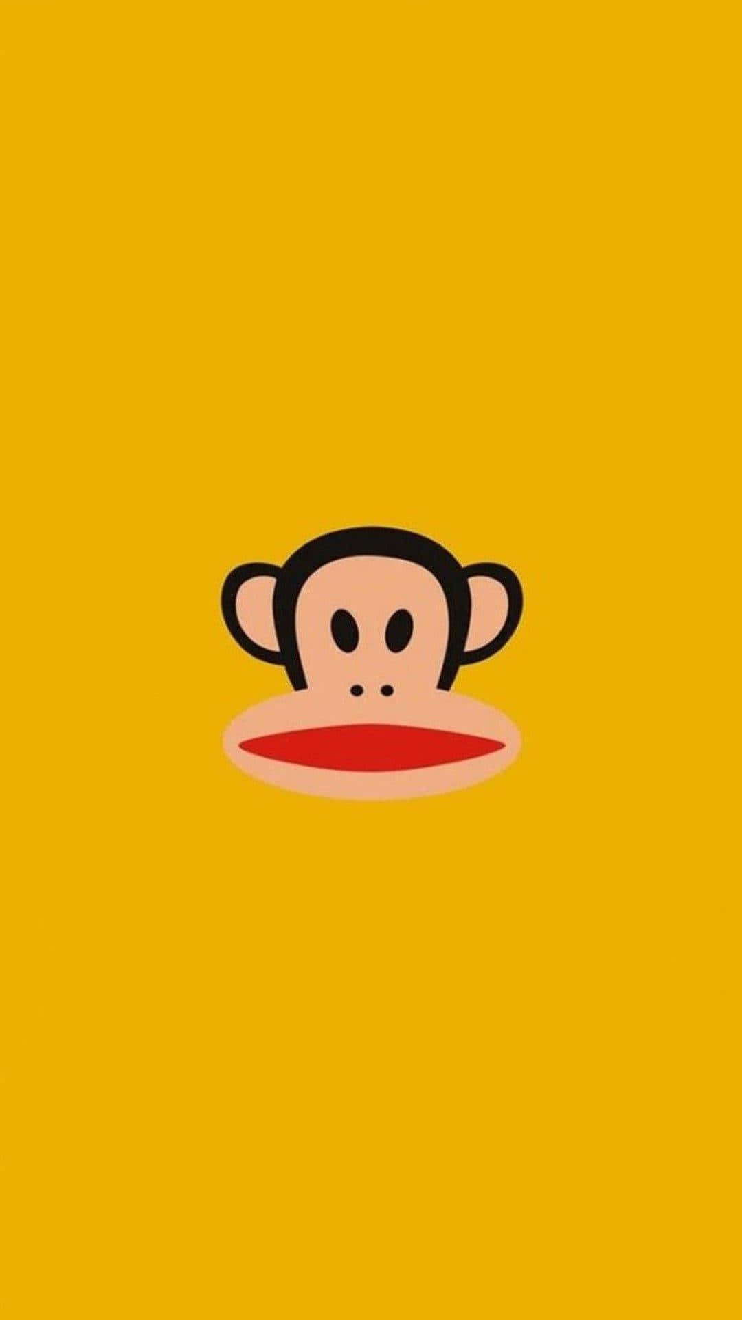 Cute Cartoon Animal 桌布 壁紙 — 一個極簡卡通猴子臉，紅唇居中，置於純黃色背景上。