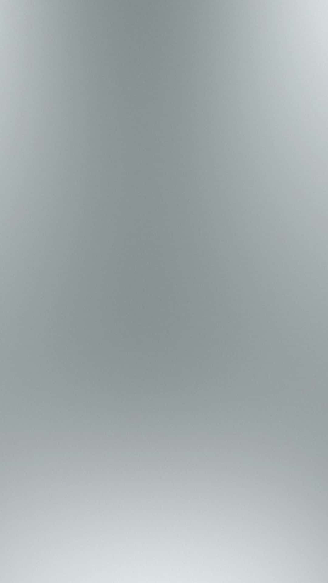 Grey Gradient 桌布 壁紙 — 一個極簡漸層背景，從淺灰色過渡到柔和白色，帶有微妙的色調變化。