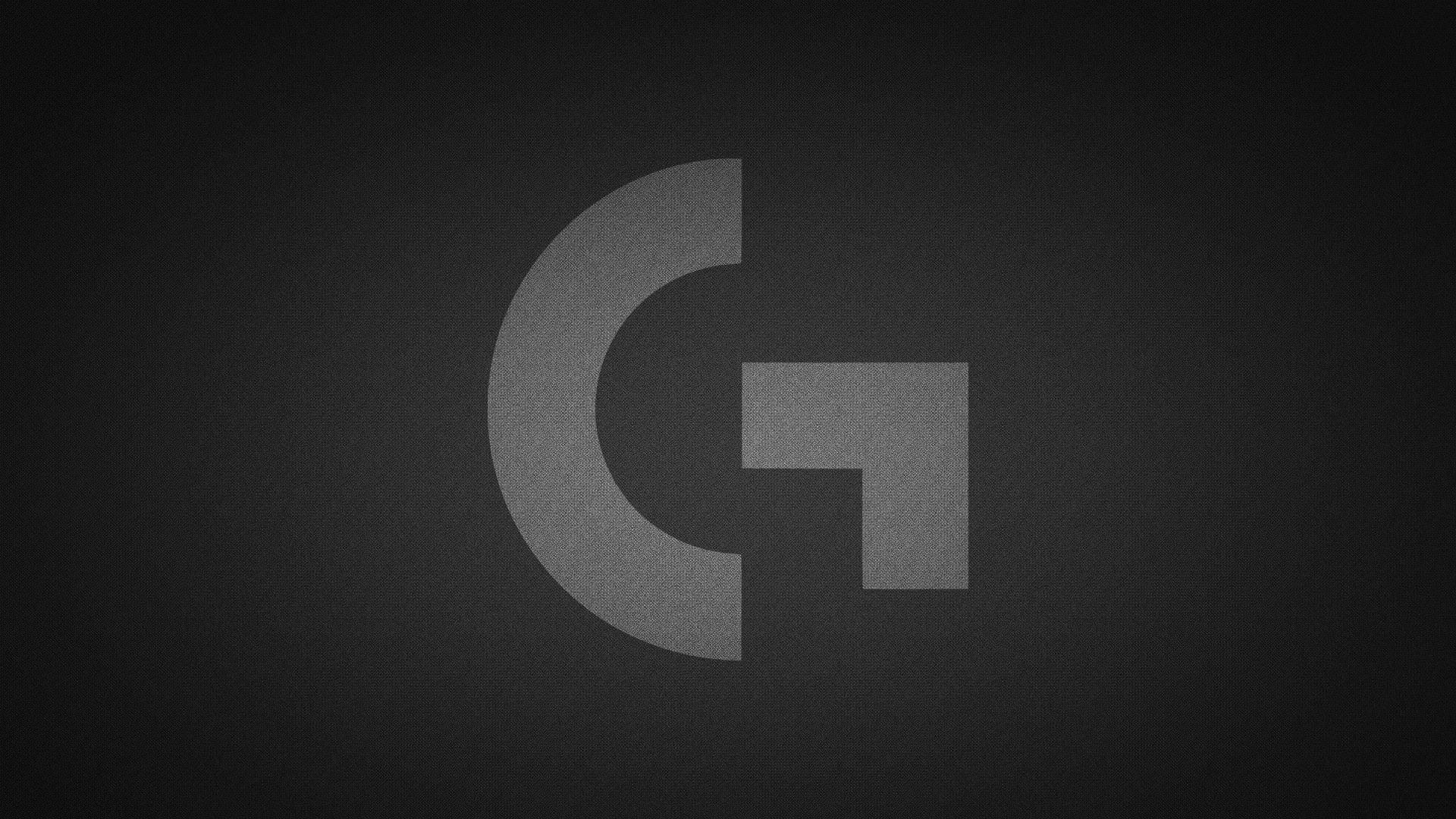 Logitech 桌布 壁紙 — 一個極簡灰色 'G' 標誌，帶有紋理表面，居中在深色漸變背景上。